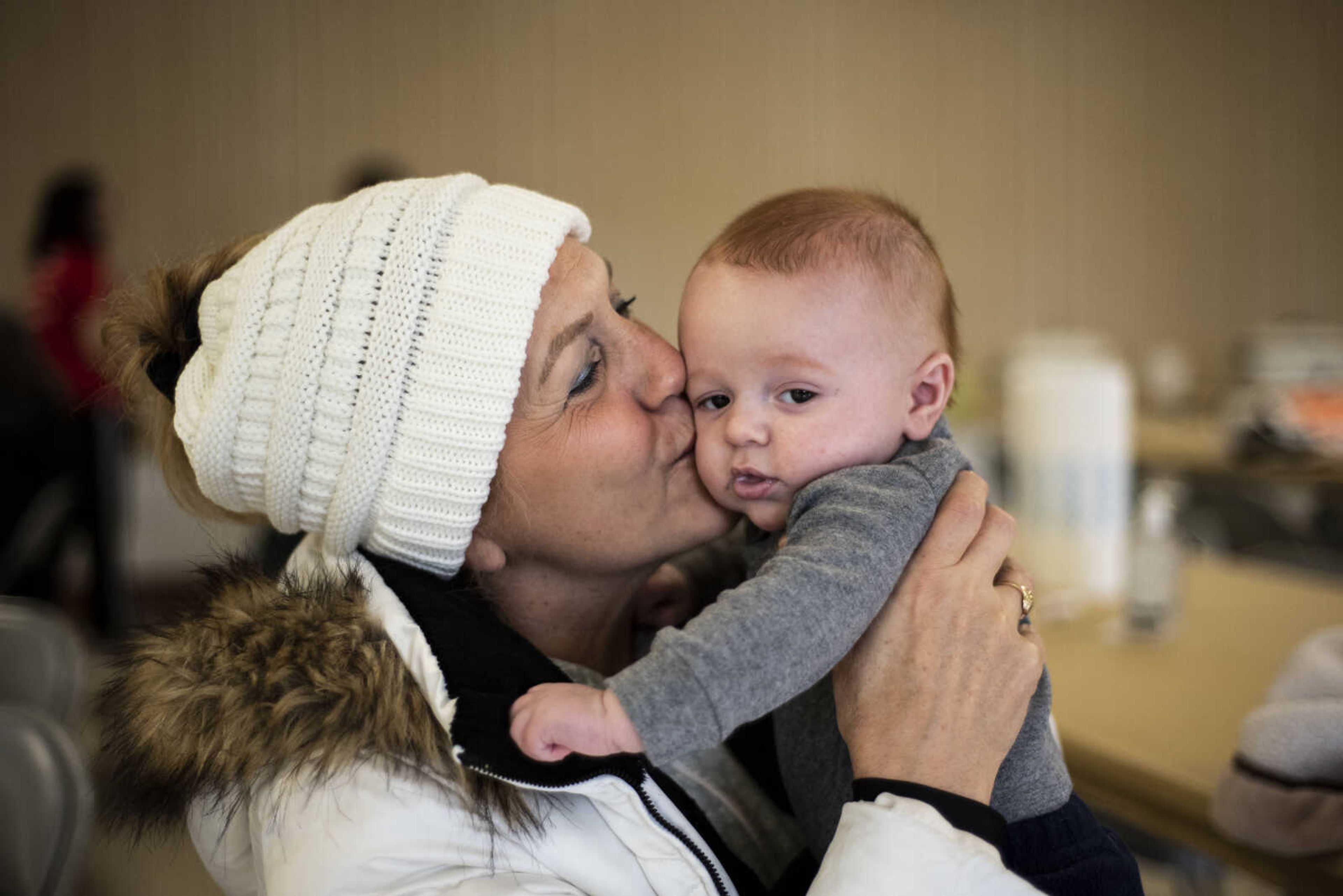 Polly Holten kisses her 3-month-old grandson, Luke Beevor, Jr., as she watches him during the Resolution Challenge Tuesday, Jan. 1, 2019, at Arena Park in Cape Girardeau.