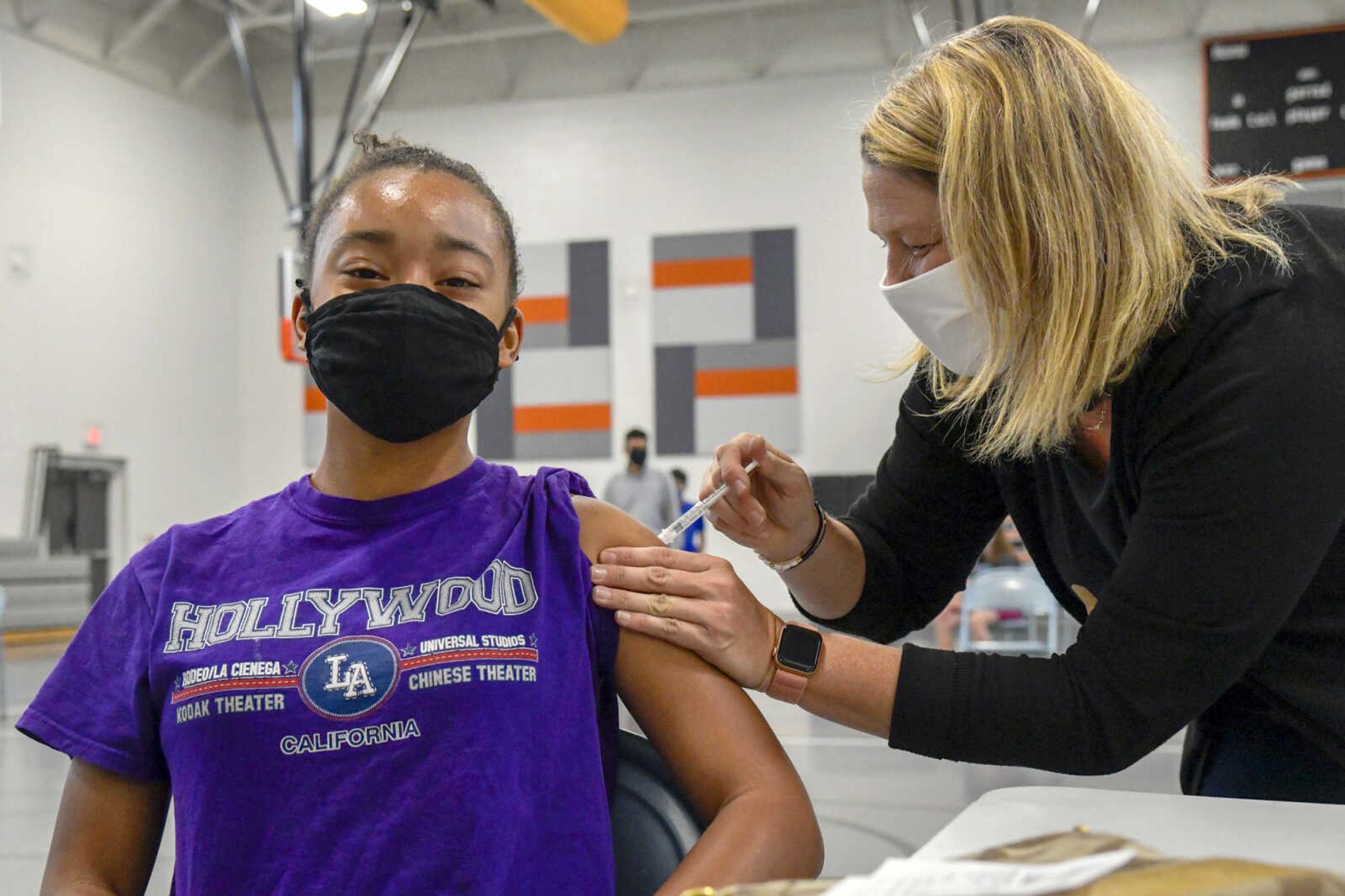 Mya Gibson, 15, gets the first dose of the Pfizer COVID-19 vaccine during a student vaccination clinic Wednesday at Terry W. Kitchen Central Junior High School in Cape Girardeau. The clinic was made possible by a partnership between Broadway Pharmacy and the Cape Girardeau School District. This is the first of its kind through Cape Girardeau schools since the Pfizer vaccine was approved for the use in children ages 12 to 17. According to Kristin Tallent, communications director for the district, about 120 students received first doses at the clinic, and a second-dose clinic June 23 will accept first-dose appointments as well. The upcoming clinic will be open to all children ages 12 to 17. Parents can sign-up at calendly.com/broadwayrx1/cjhs-2nd-pfizer-covid-19-vaccination-clinic?month=2021-06.