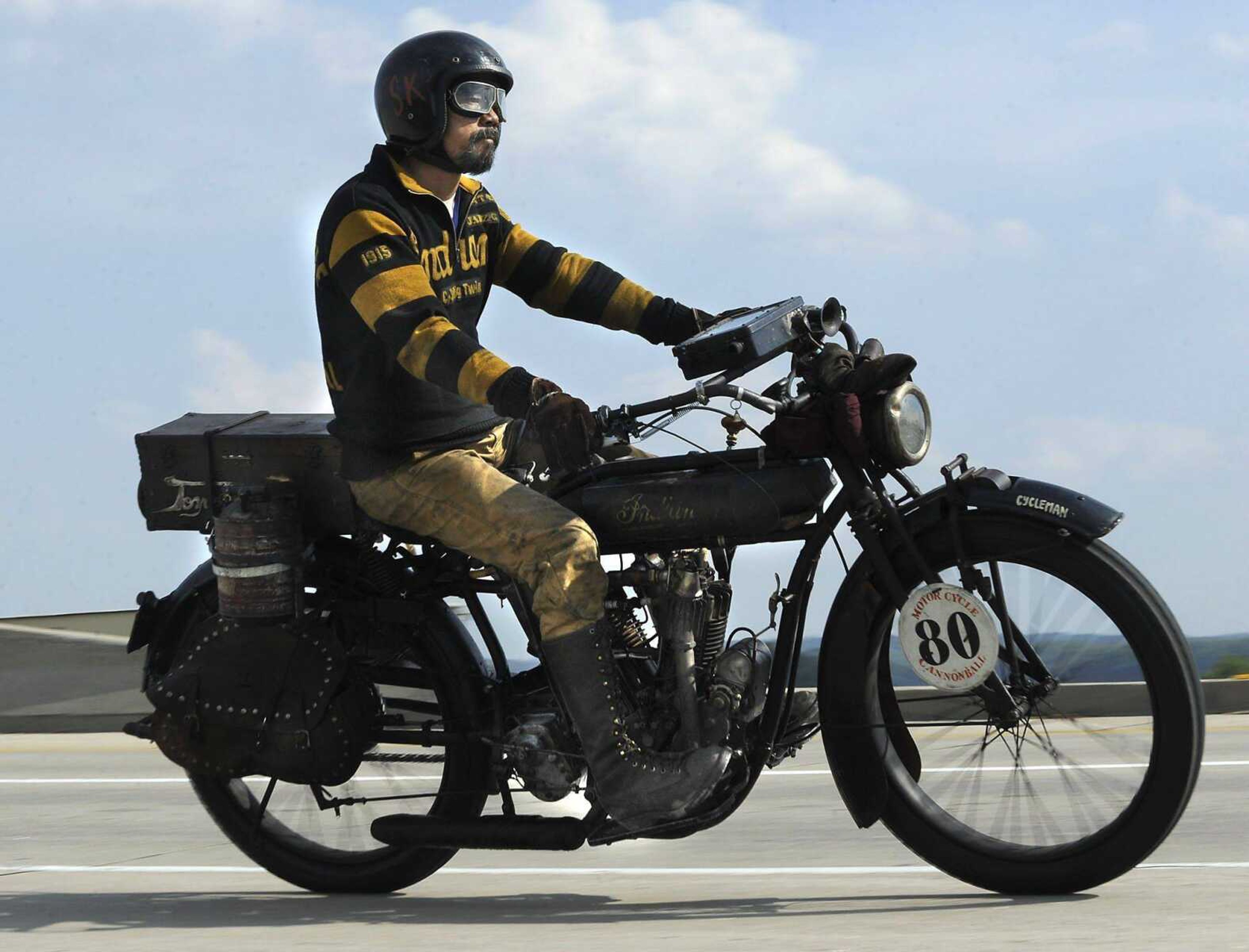 Shinya Kimura of California rides his 1915 Indian Twin across the Bill Emerson Memorial Bridge for the Motorcycle Cannonball Endurance Run on Tuesday in Cape Girardeau. (Fred Lynch)