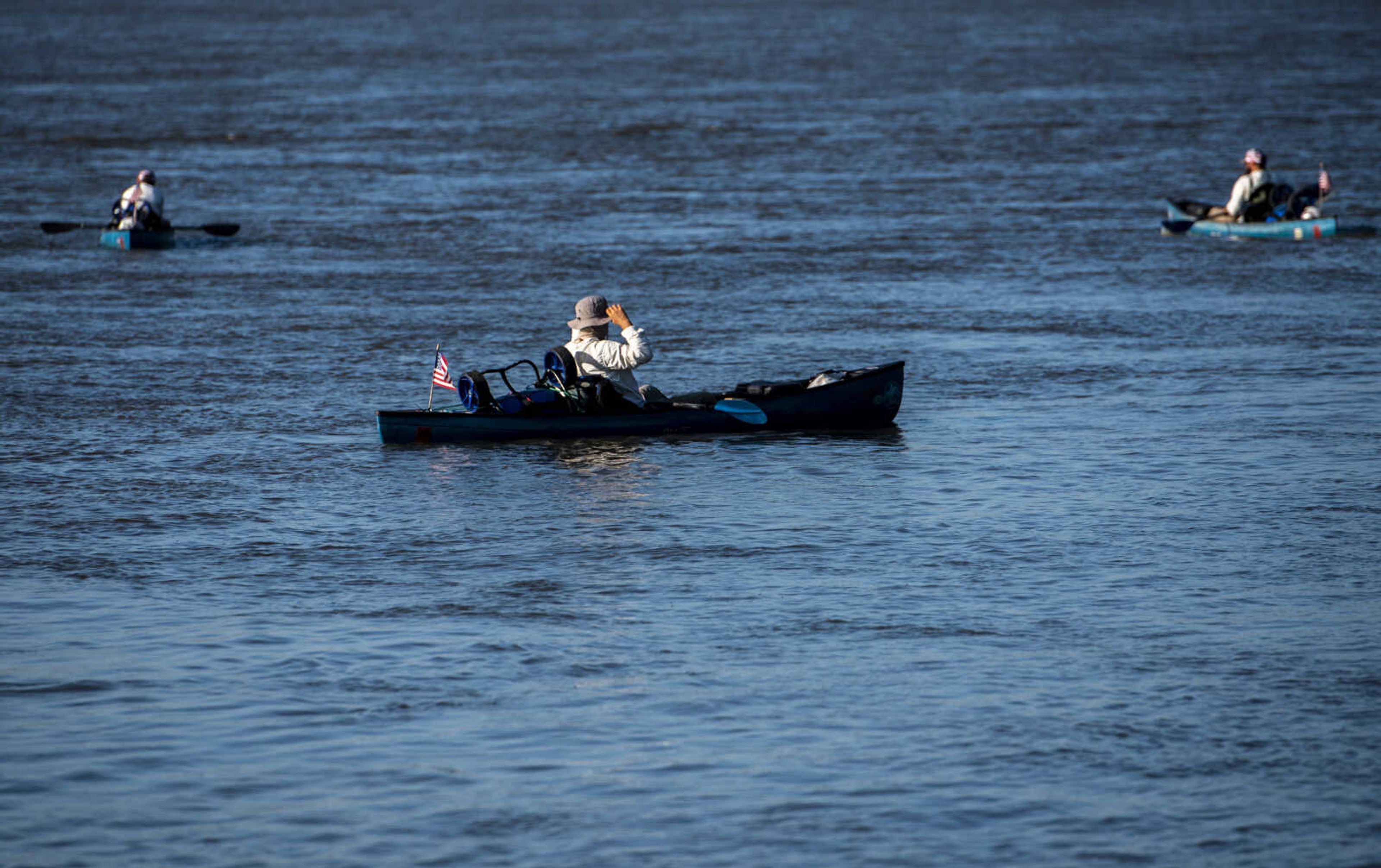 The Warrior Paddle Expedition trip, Rick Baine, Ryan Webb and Matt Roy Webb make their way down the Mississippi River through Cape Girardeau Tuesday, Aug. 28, 2018 as part of the Warrior Paddle Expedition, starting at the source of the Mississippi River, Lake Itsaca, Minnesota, and ending in the Gulf of Mexico.