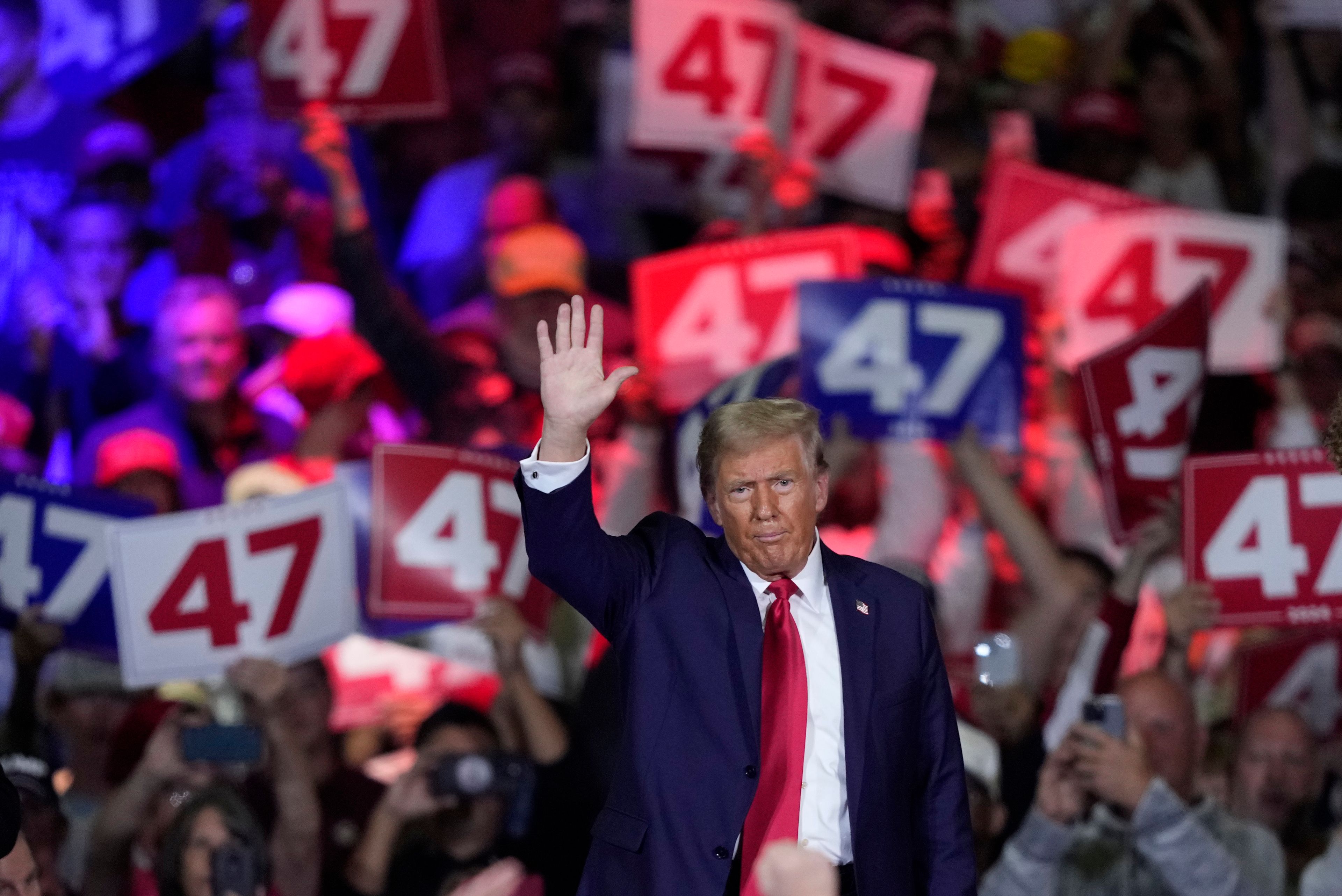 Republican presidential nominee former President Donald Trump waves at a town hall in Lancaster, Pa., Sunday, Oct. 20, 2024. (AP Photo/Susan Walsh)