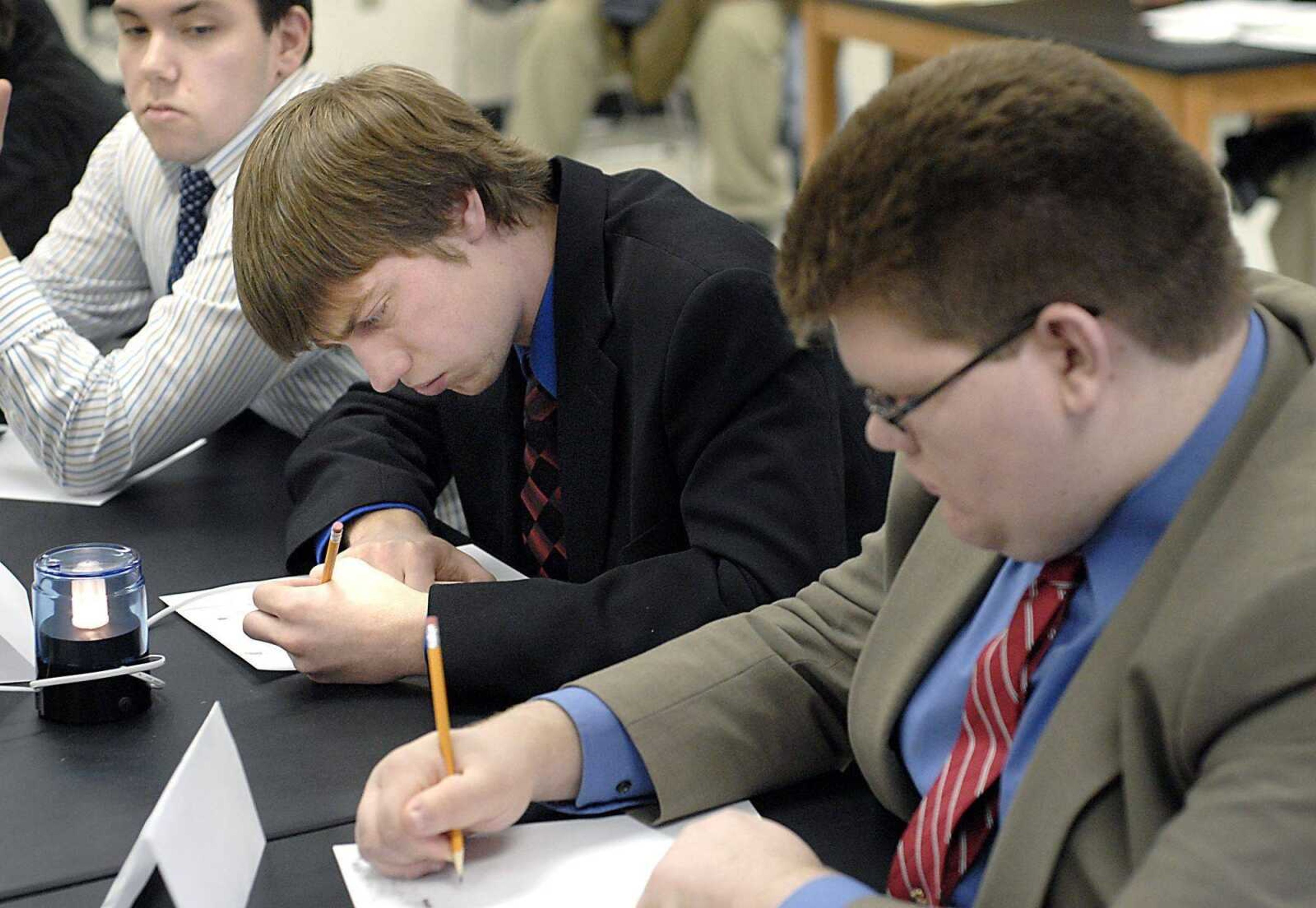 Jackson captain Jesse Eichhorn, center, finished a math question Saturday during the Academic Challenge. Teammates Caleb Jones, left, and Gabe Eggers awaited his answer. <br>KIT DOYLE <br>kdoyle@semissourian.com