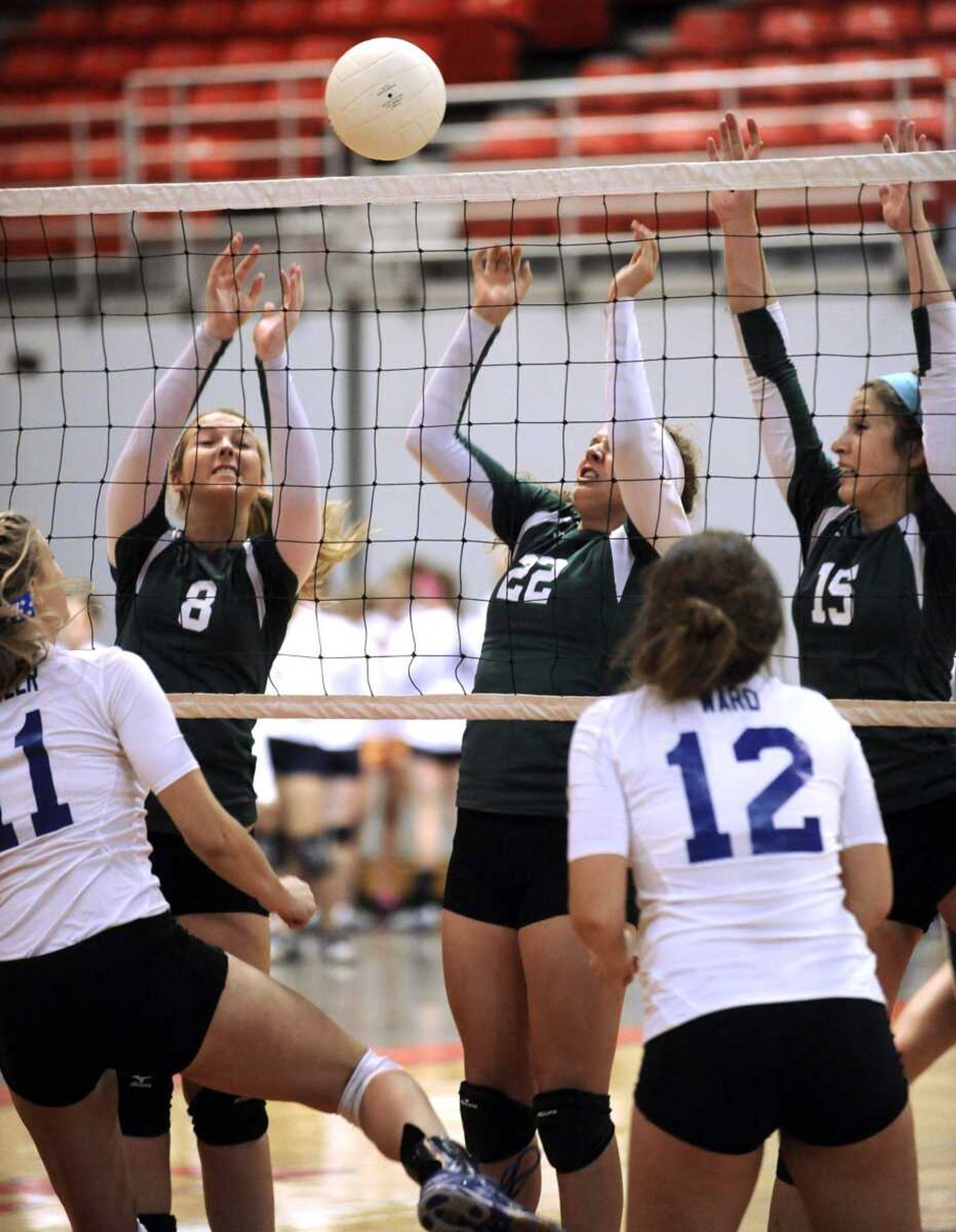 Perryville's Lauren Buxton, left, Alex Spears and Kristen Triller try to block a shot by Notre Dame's Miranda Fowler in their match of the SEMO Spike Volleyball Classic Saturday, Sept. 8, 2012 at the Show Me Center. (Fred Lynch)