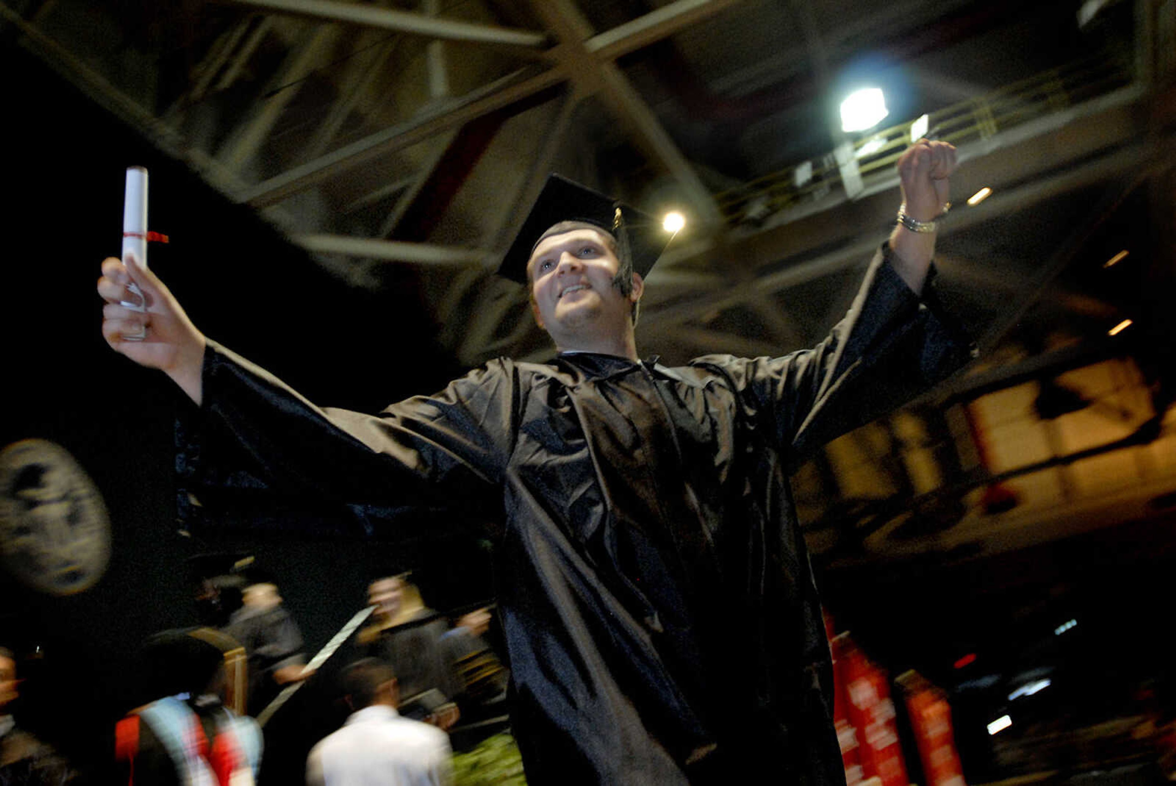 ELIZABETH DODD ~ edodd@semissourian.com
Southeast Missouri State University graduate Matt Heard turns to family and friends after walking the stage at the commencement service Saturday at the Show Me Center.