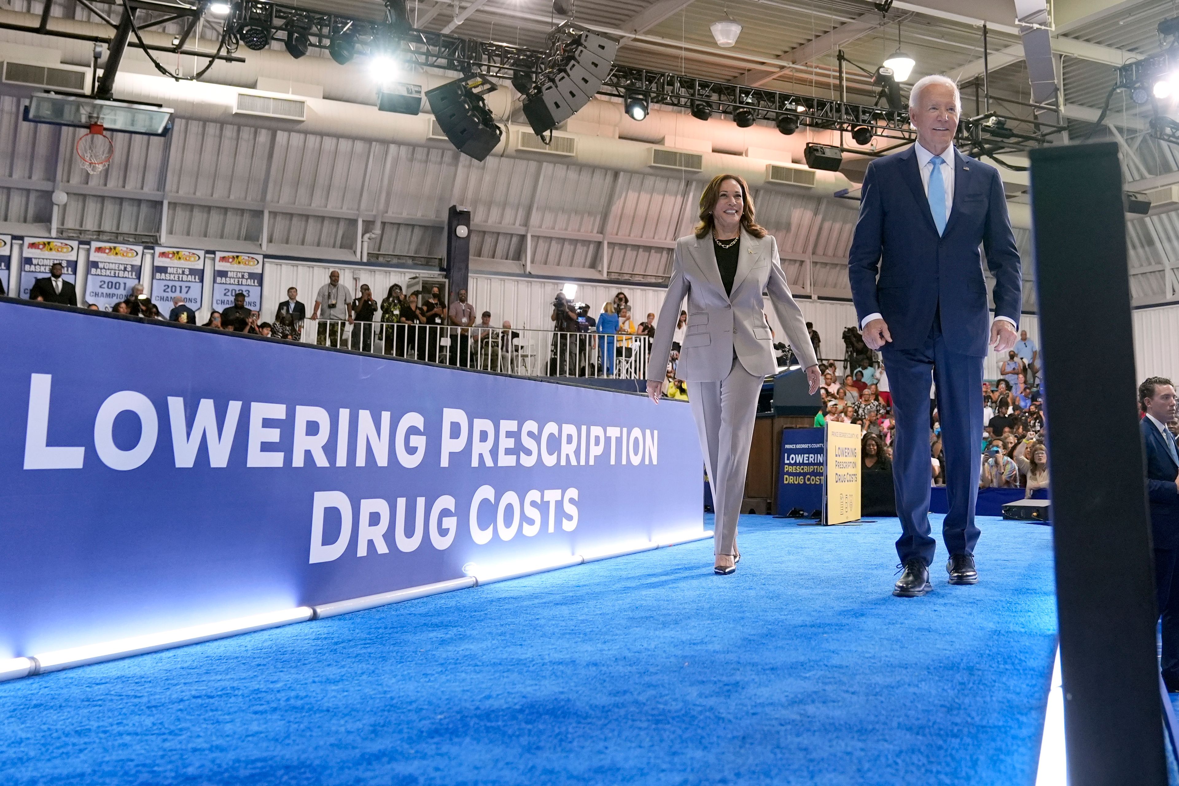 Democratic presidential nominee Vice President Kamala Harris, left, and President Joe Biden depart after speaking about the administration's efforts to lower prescription drug costs during an event at Prince George's Community College in Largo, Md., Thursday, Aug. 15, 2024. (AP Photo/Susan Walsh)