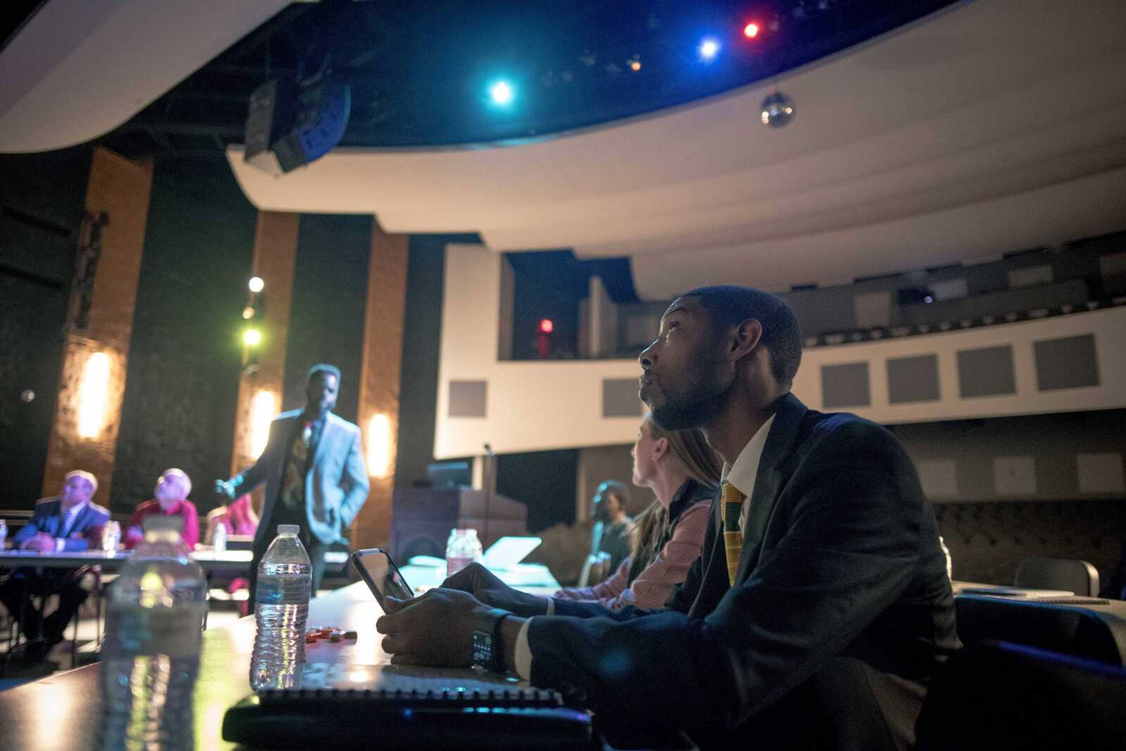 Representative Kevin Windham, right, listens to a presentation about the Honorable Young Men Club during a visit from regional politicians and members of the Missouri state legislature's black caucus Friday, Oct. 25, 2019, at Cape Central High School.