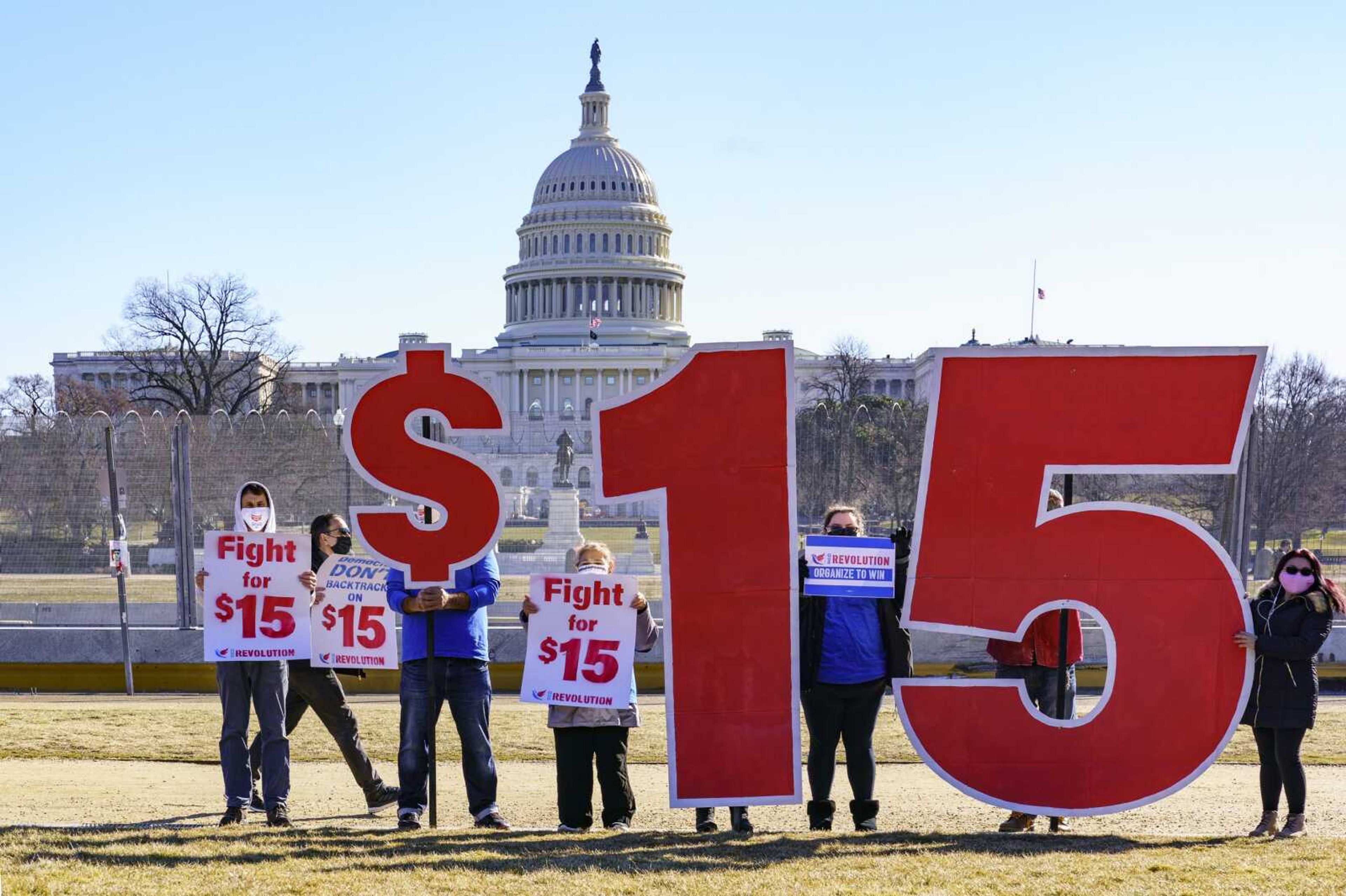 Activists appeal for a $15 minimum wage near the Capitol on Thursday in Washington.