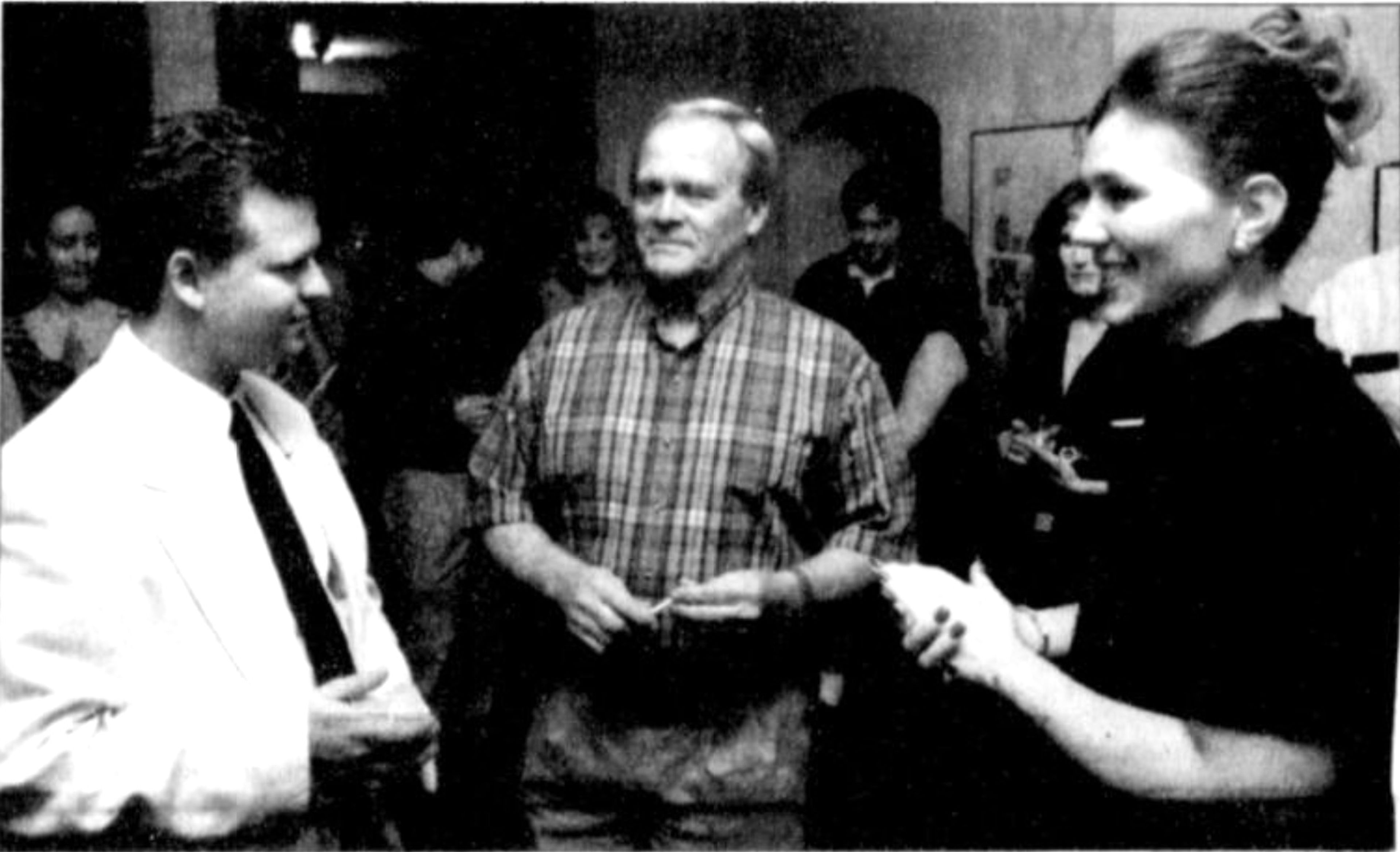 Daniel North, left, executive director of the Arts Council of Southeast Missouri, and Leslie Stucker, assistant to the director, present Dr. Edwin Smith, center, the Otto F. Dingledein Award on Friday, Oct. 1, 1999.
