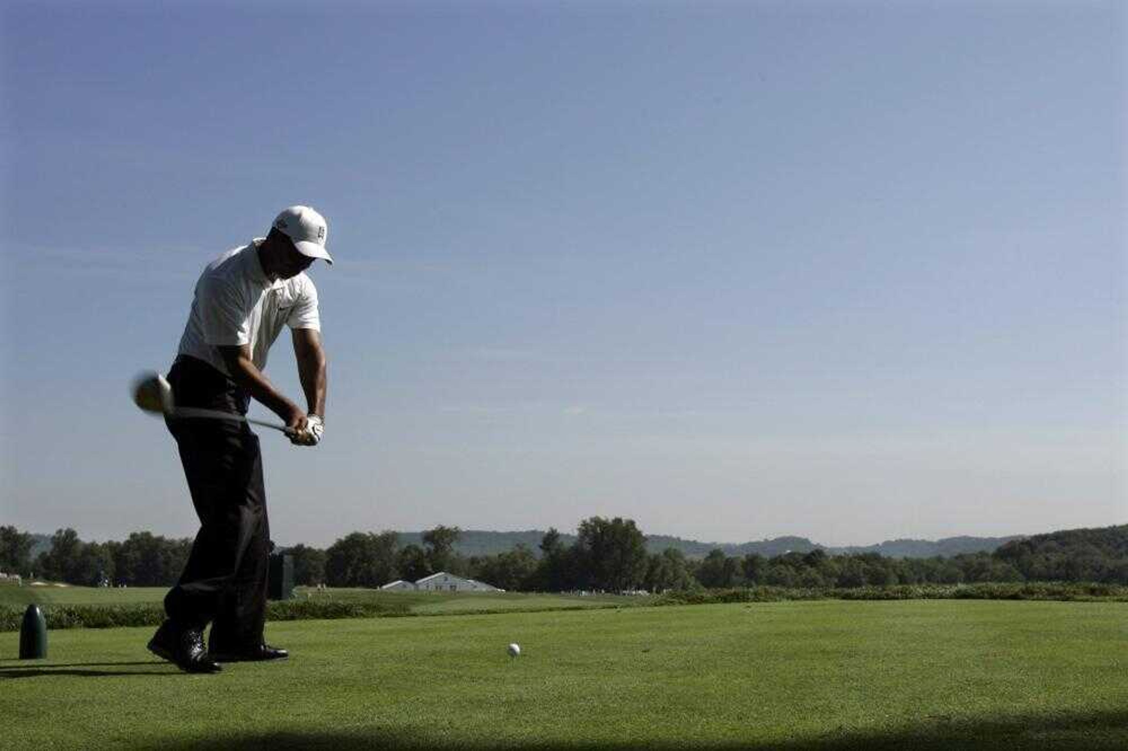 Tiger Woods teed off on the 12th hole during his practice round Tuesday at the Oakmont Country Club in Oakmont, Pa. (Morry Gash ~ Associated Press)