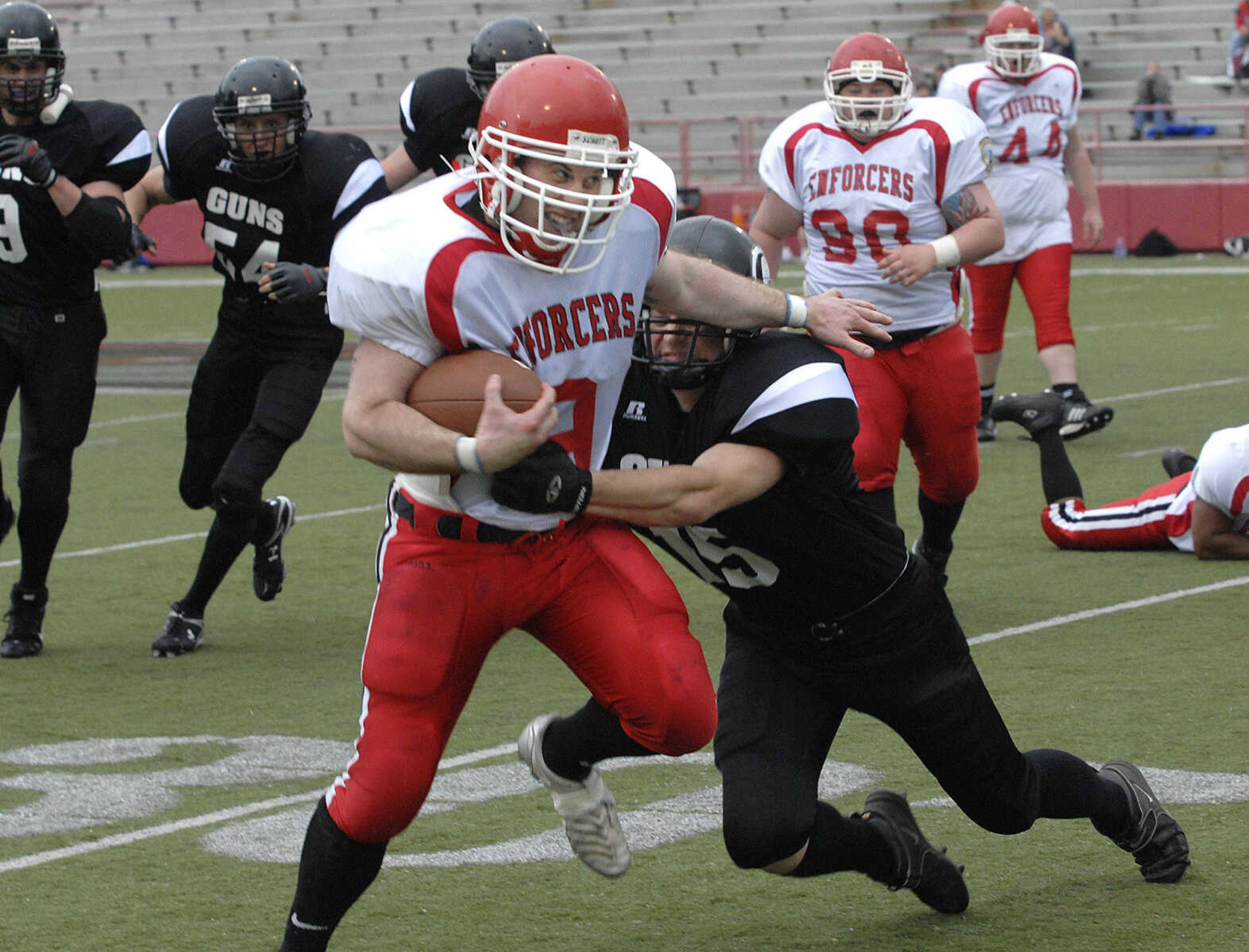 Cape County Enforcers running back Blake Jamison gains yardage before being tackled by Springfield Guns' Fred Beck.