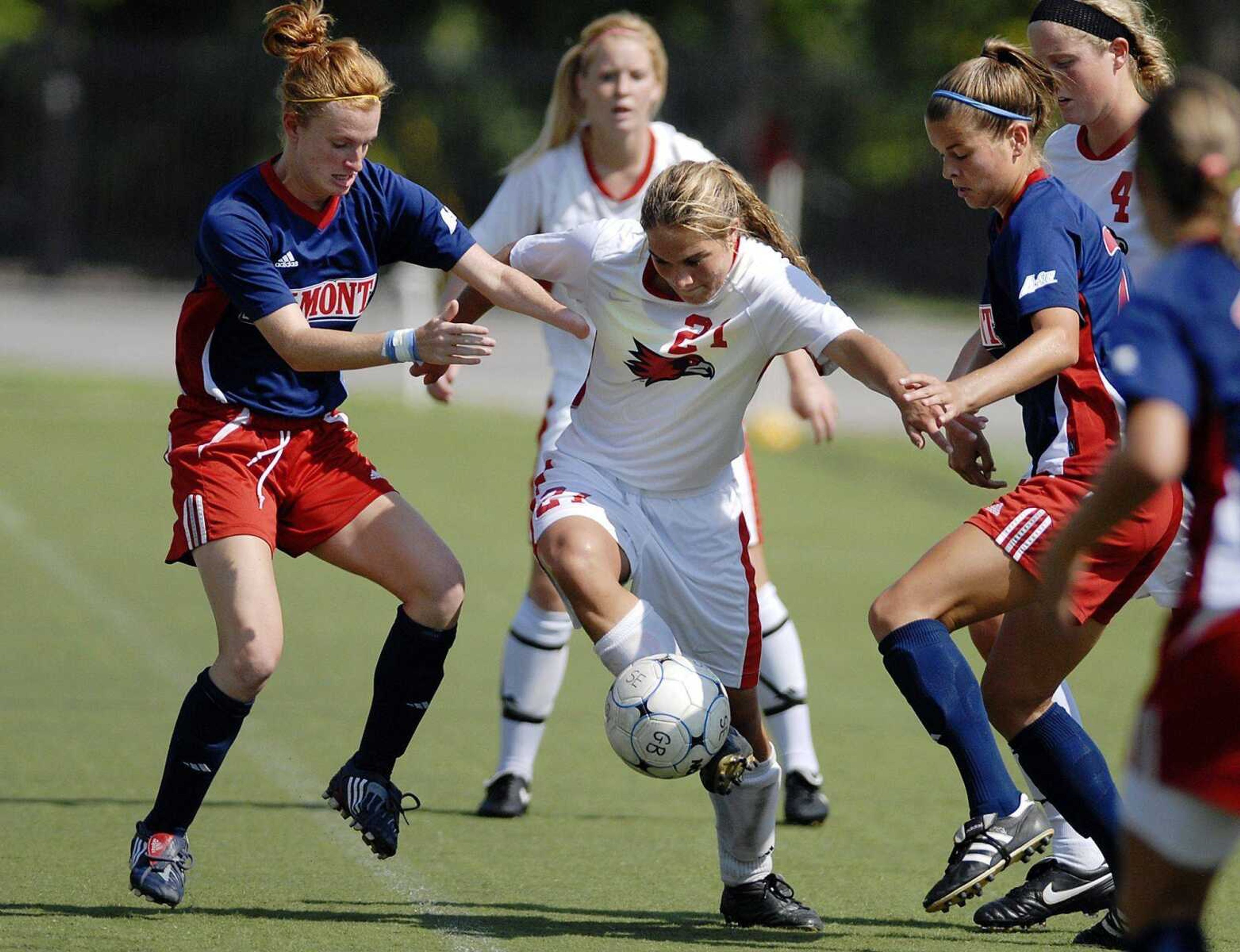 Southeast Missouri State's Taylor Byrd controls the ball while surrounded by Belmont defenders Patience Whitten, left, and Madison Porter during Sunday's season-opening game at Houck Stadium. Southeast won 2-1 in overtime. (Laura Simon)