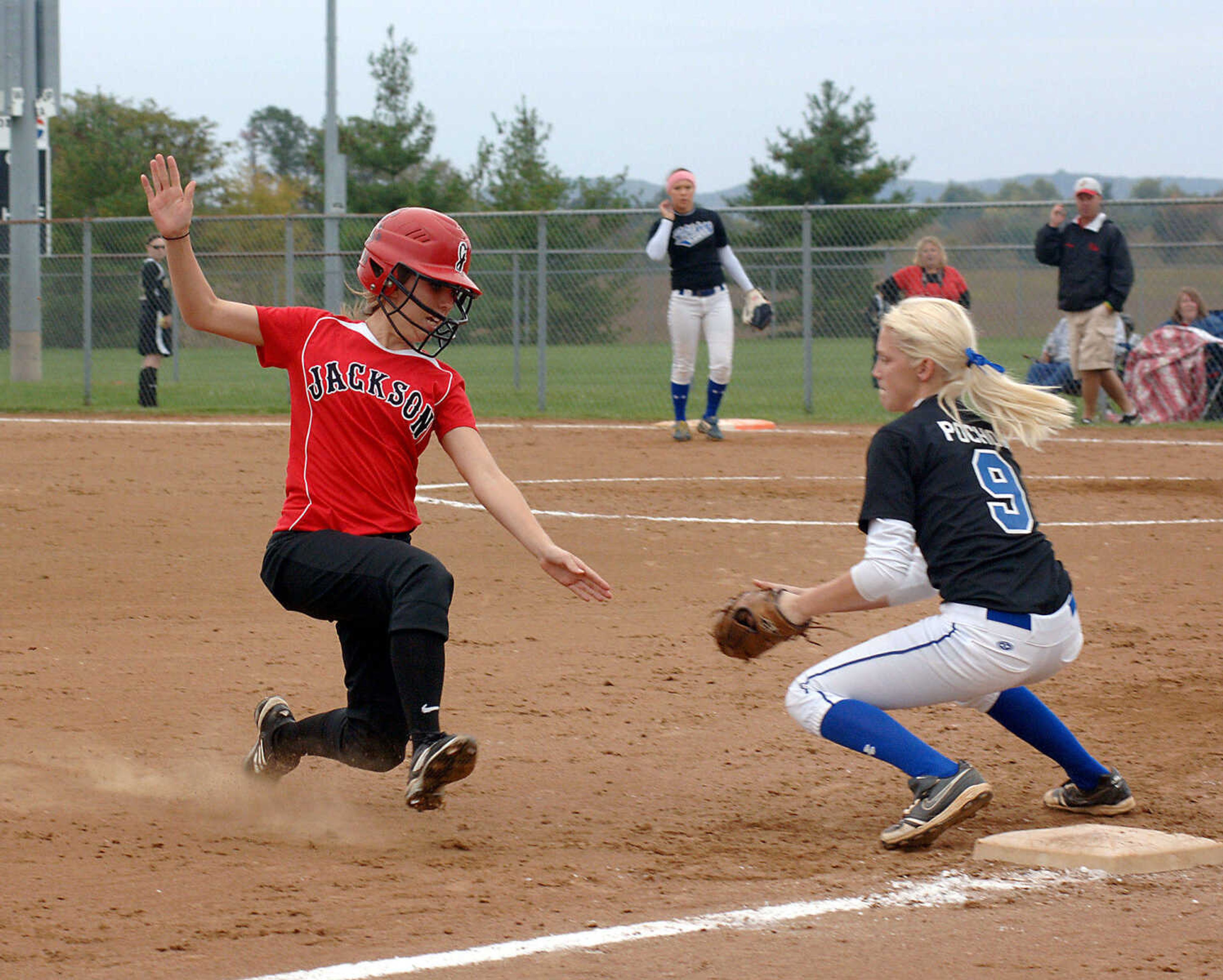 LAURA SIMON~photos@semissourian.com
Jackson's Haley Rothenberger tries to slide safely into third base as Hillsboro's Kara Pochon waits to tag her out.