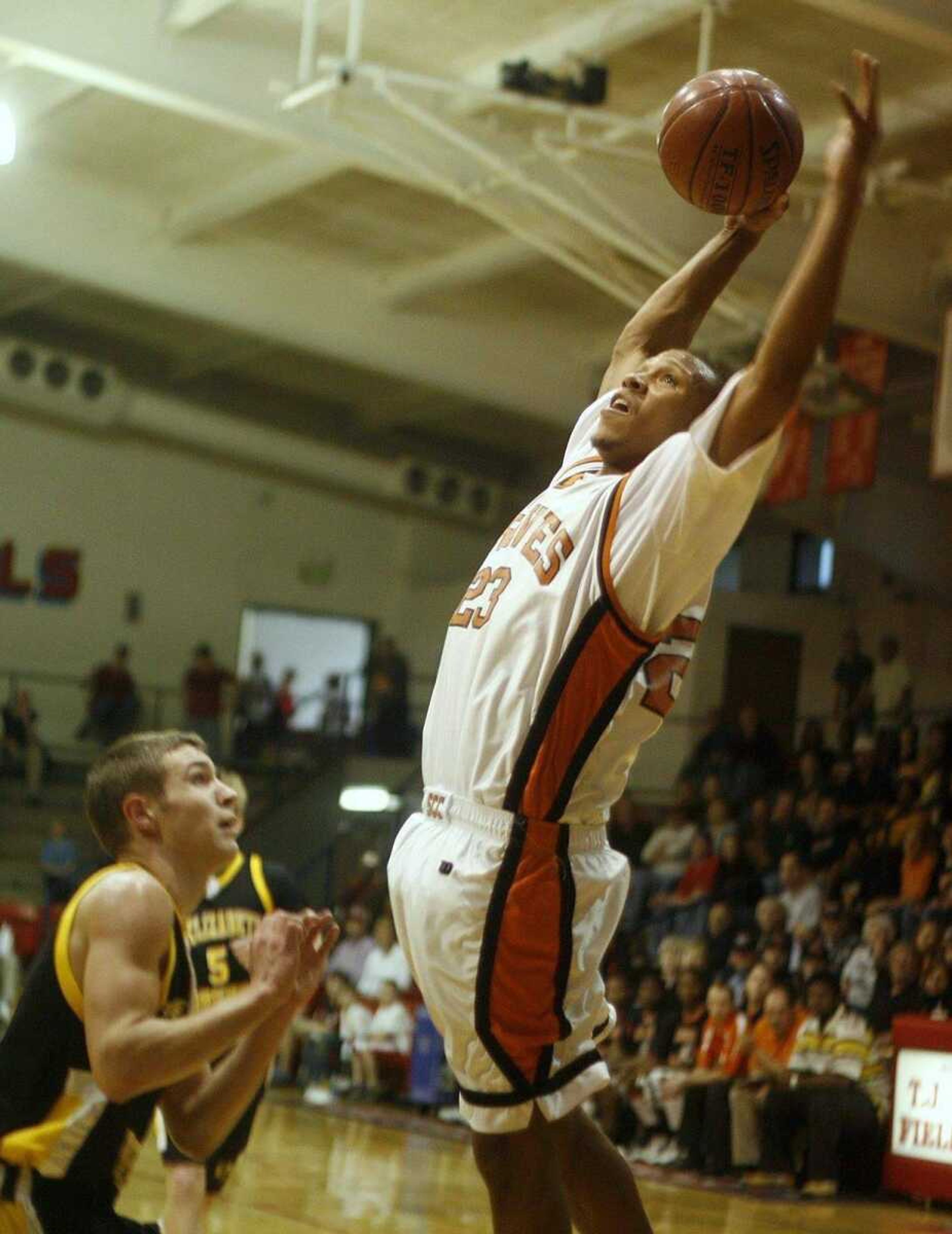 ELIZABETH DODD ~ edodd@semissourian.com<br>Scott County Central's Drew Thomas dunks during the first half of the Braves' 105-77 victory against St. Elizabeth in Class 1 sectional action Tuesday. Thomas has been averaging 25.3 points per game in the postseason.