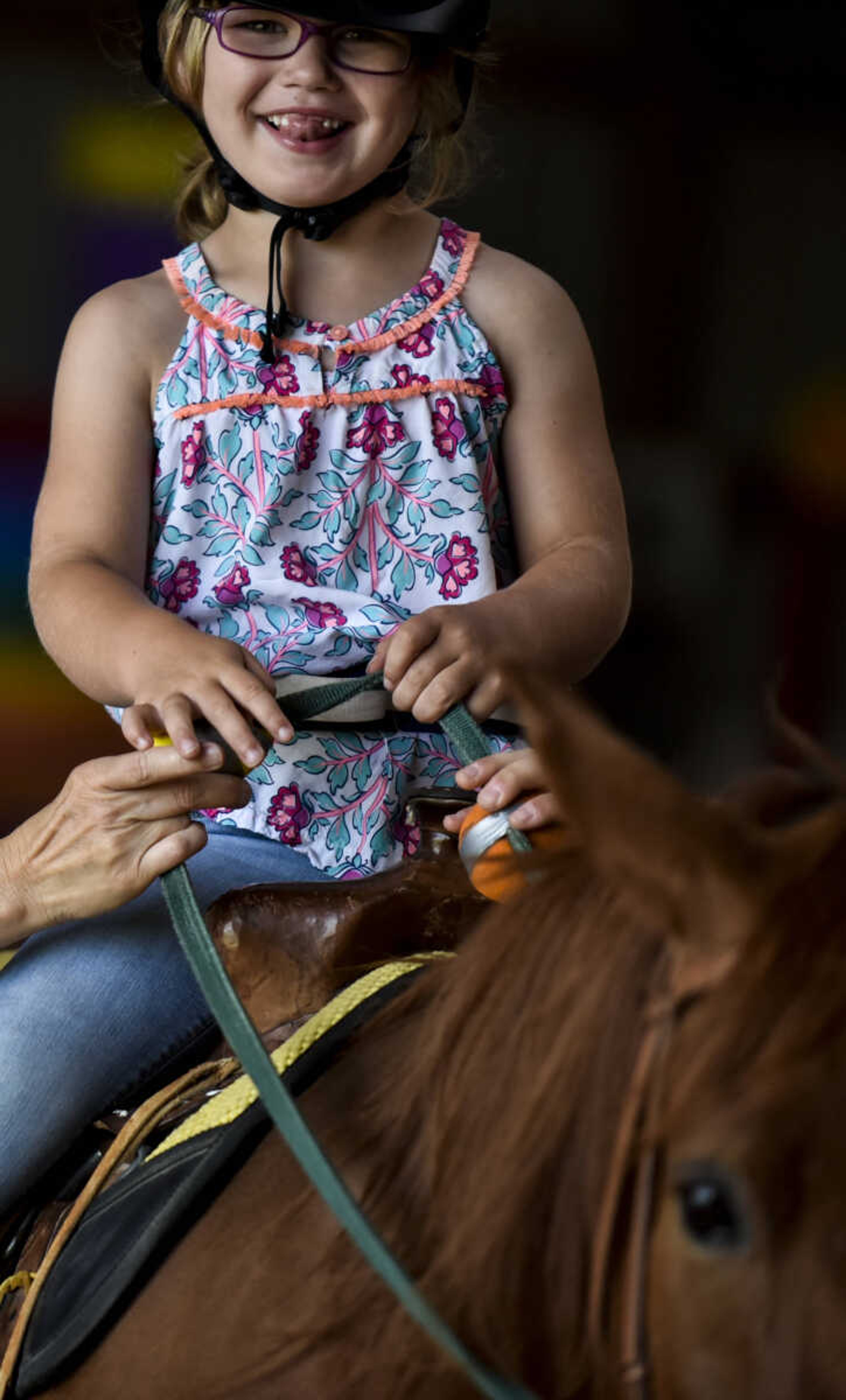 Lindyn Davenport rides Ranger, 15, during a summer camp session at Mississippi Valley Therapeutic Horsemanship Friday, June 8, 2018 in Oak Ridge.