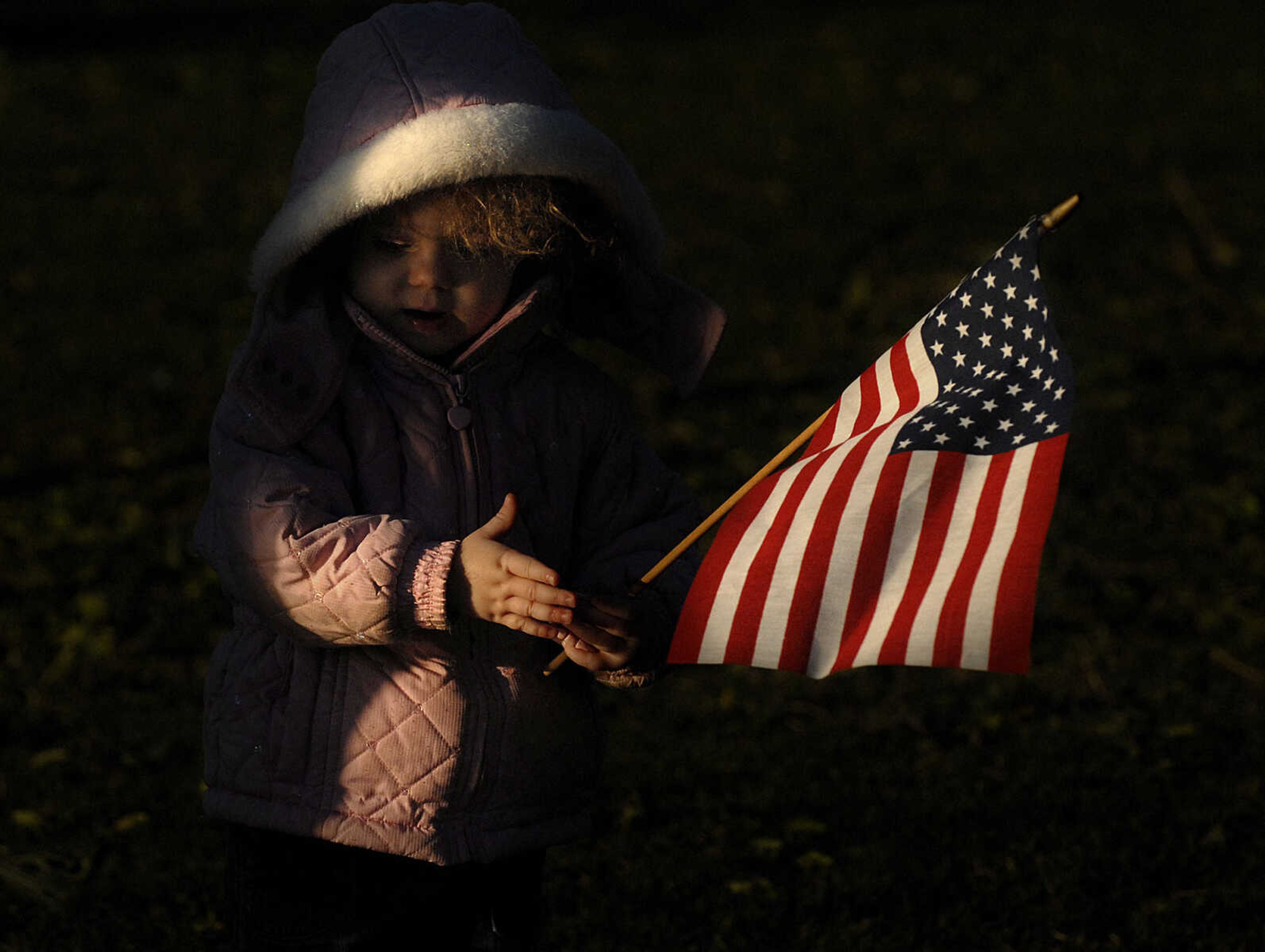 ELIZABETH DODD ~ edodd@semissourian.com
Elizabeth Proctor, 2, plays with a flag while her mother listens to the speakers at the tax protest.