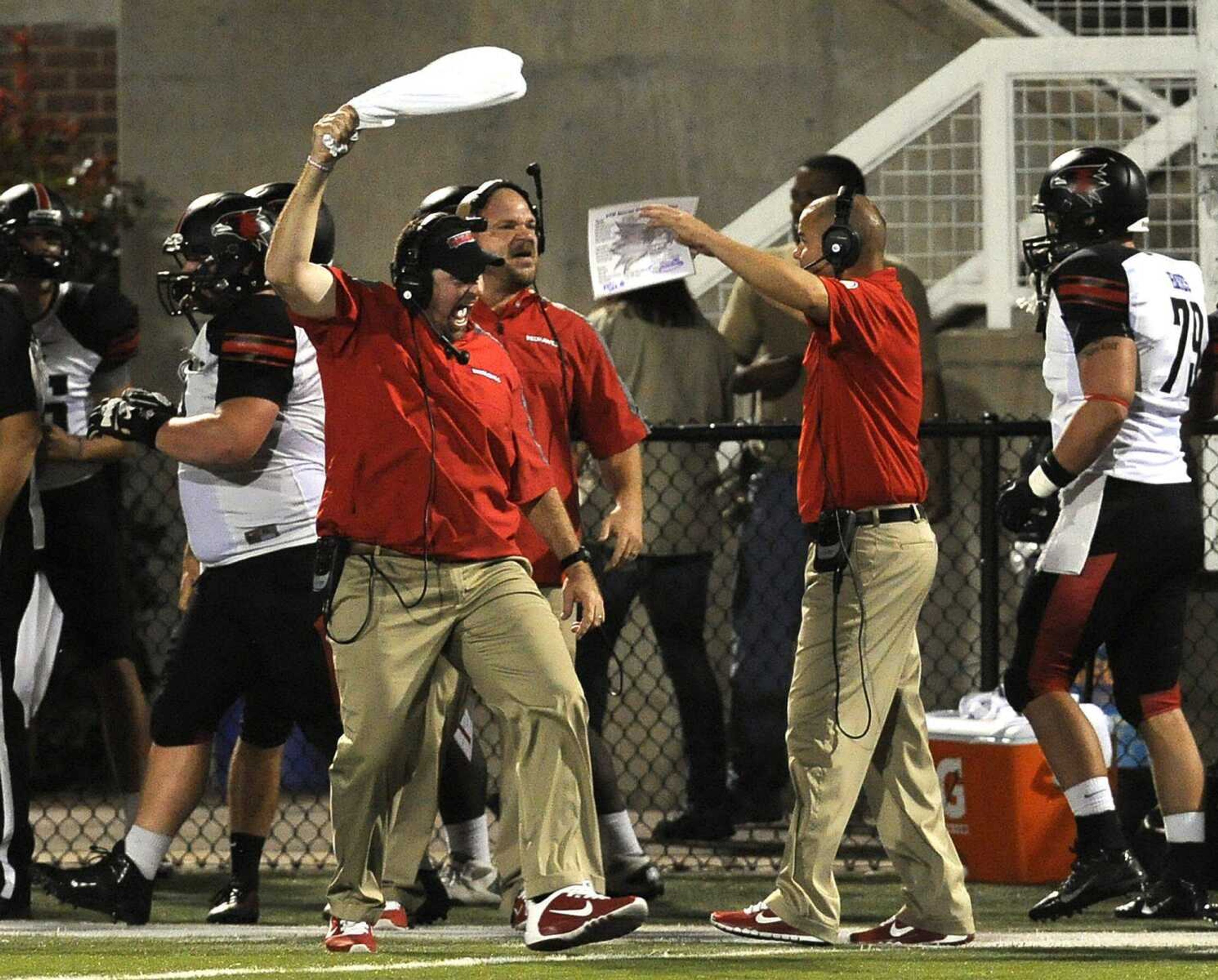 Southeast Missouri State coach Tom Matukewicz and his assistants celebrate their fourth-down stop of UT Martin in the final moments of Saturday&#8217;s game. (Fred Lynch)