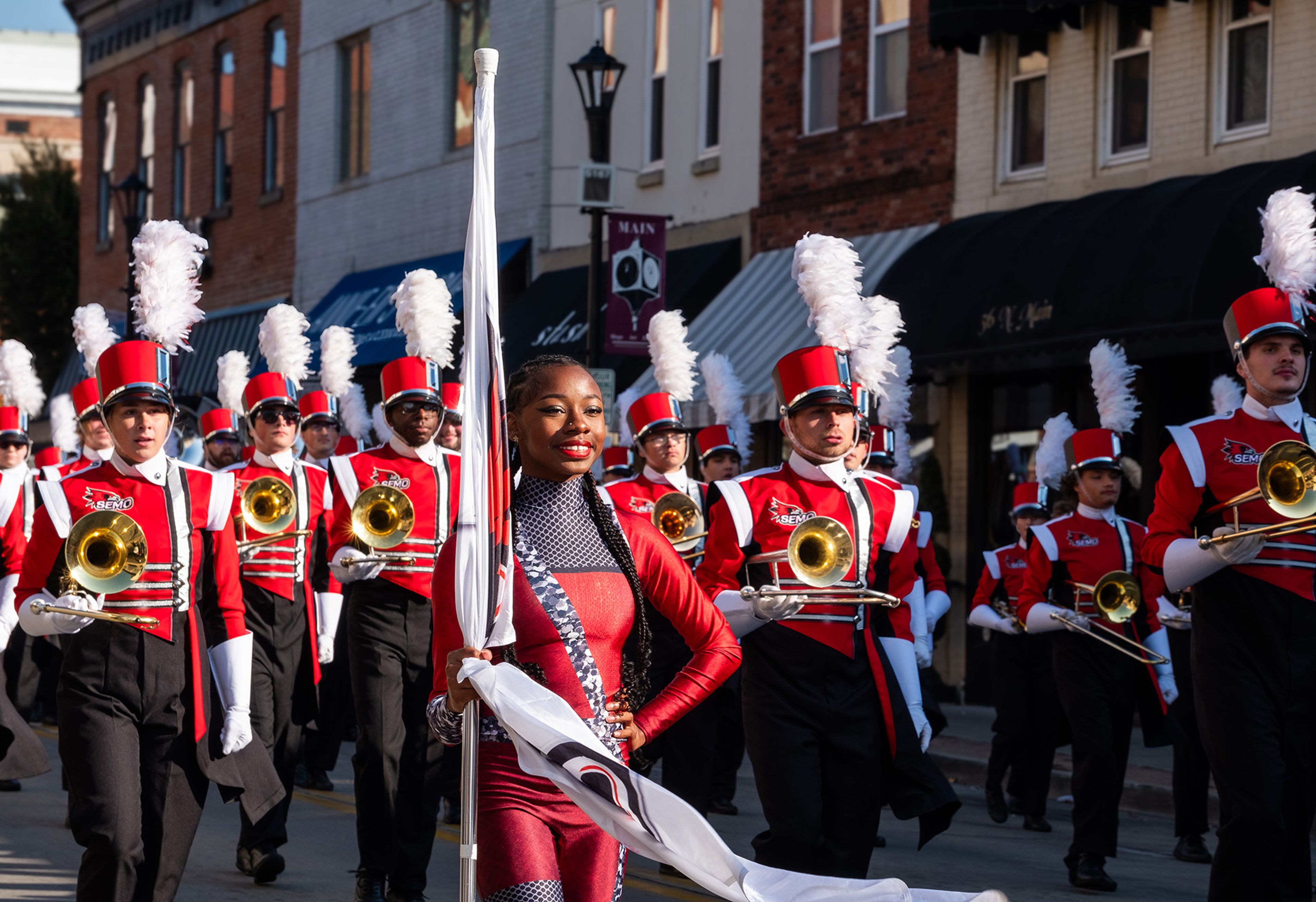 Members of the SEMO Marching Band smile between sets.