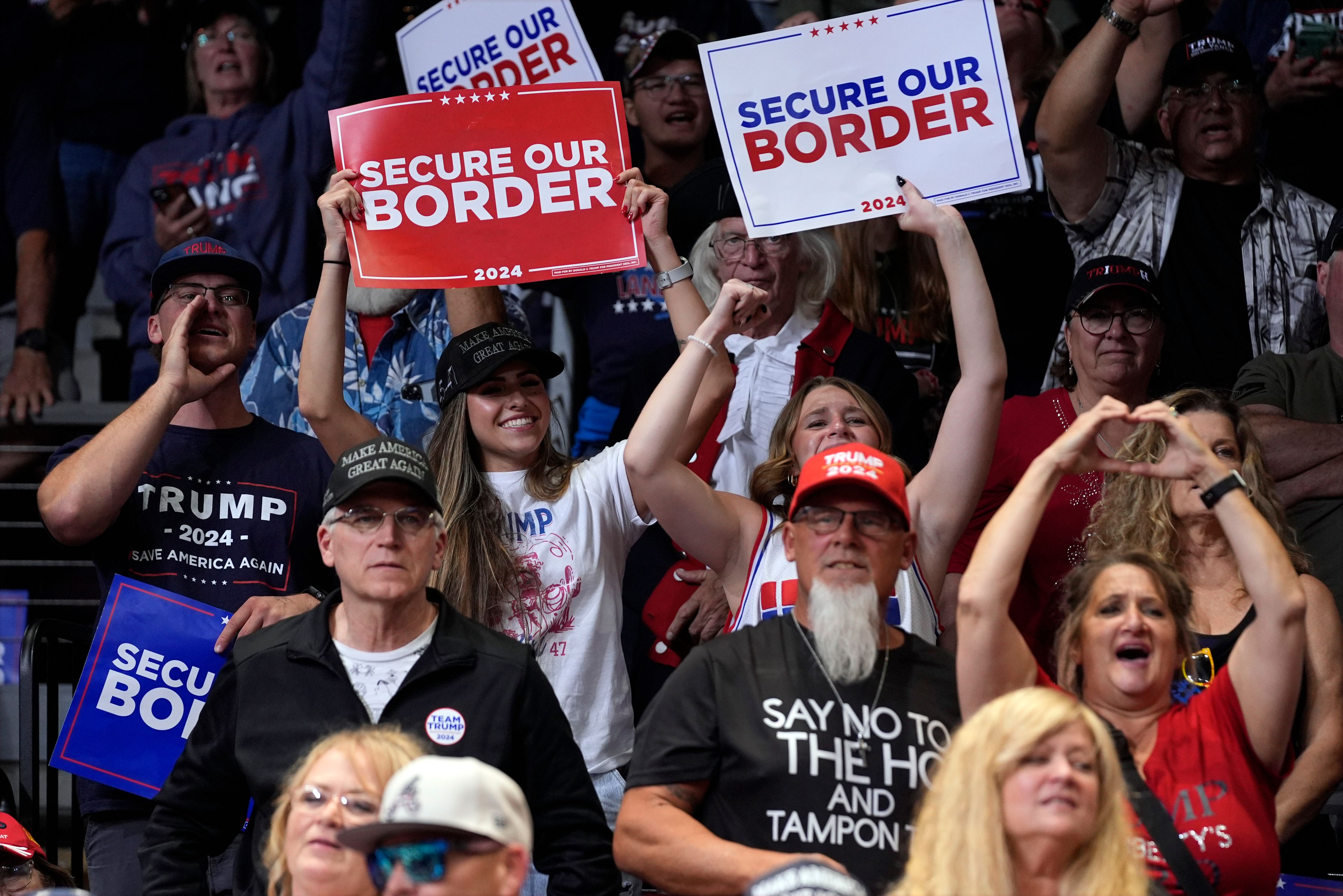 Supports react as Republican presidential nominee former President Donald Trump speaks at a campaign rally at the Findlay Toyota Arena Sunday, Oct. 13, 2024, in Prescott Valley, Ariz. (AP Photo/Evan Vucci)