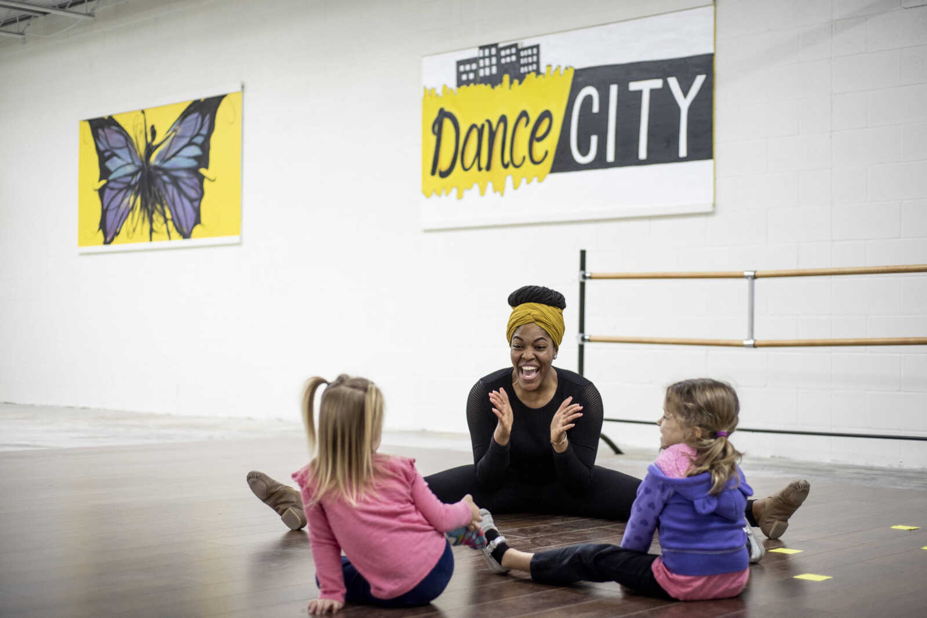 Jecala Amos claps and encourages cousins Josie Oslund, 2, left, and Nora Oslund, 4, right, during her Monday morning "baby hop" class Monday, Feb. 4, 2019, at Dance City in Cape Girardeau.