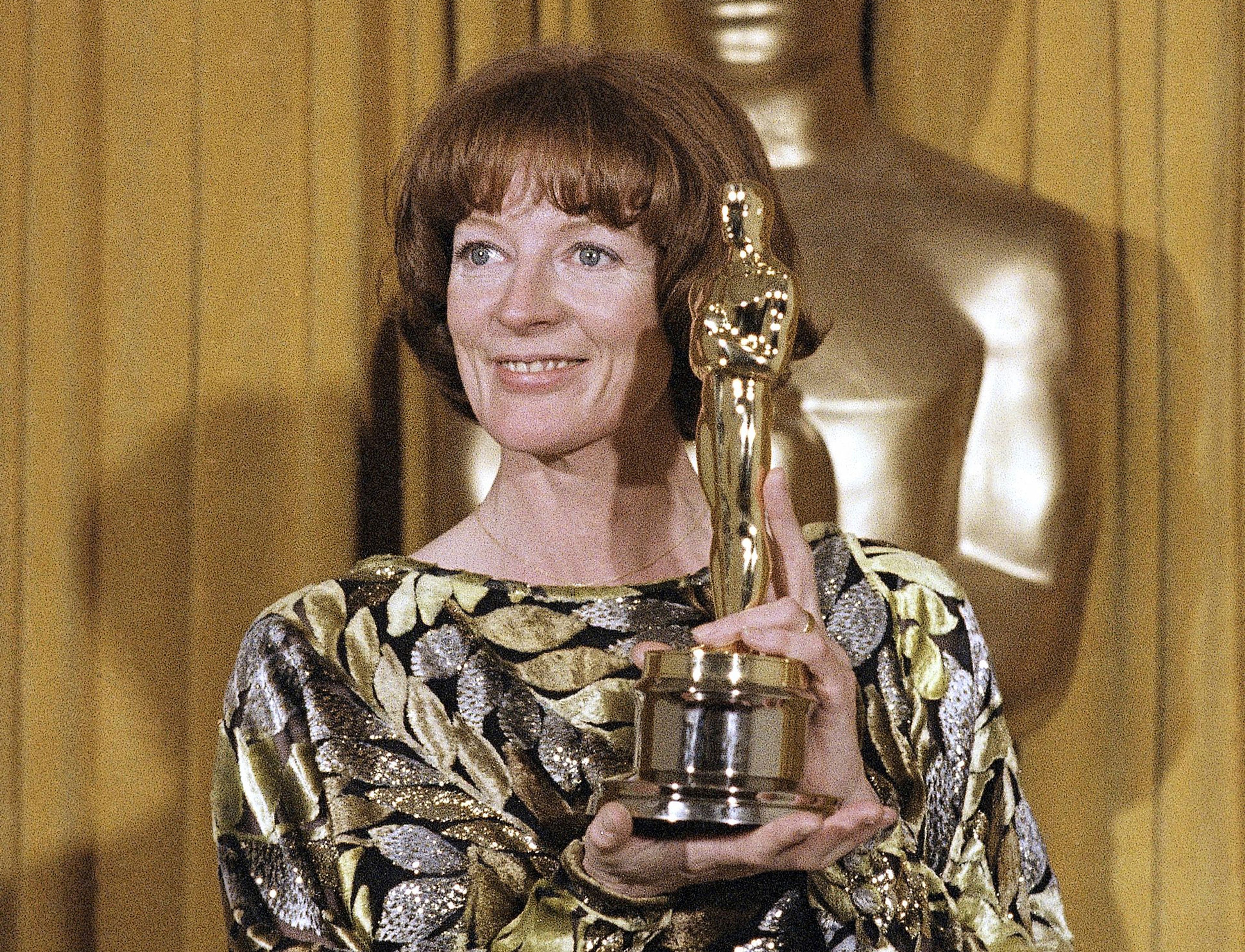 FILE - Actress Maggie Smith holds her Oscar for best supporting actress in the film "California Suite" in Los Angeles, April 9, 1979. Smith, who won an Oscar for “The Prime of Miss Jean Brodie” in 1969 and won new fans in the 21st century as the dowager Countess of Grantham in “Downton Abbey,” has died at 89. (AP Photo/Reed Saxon, File)