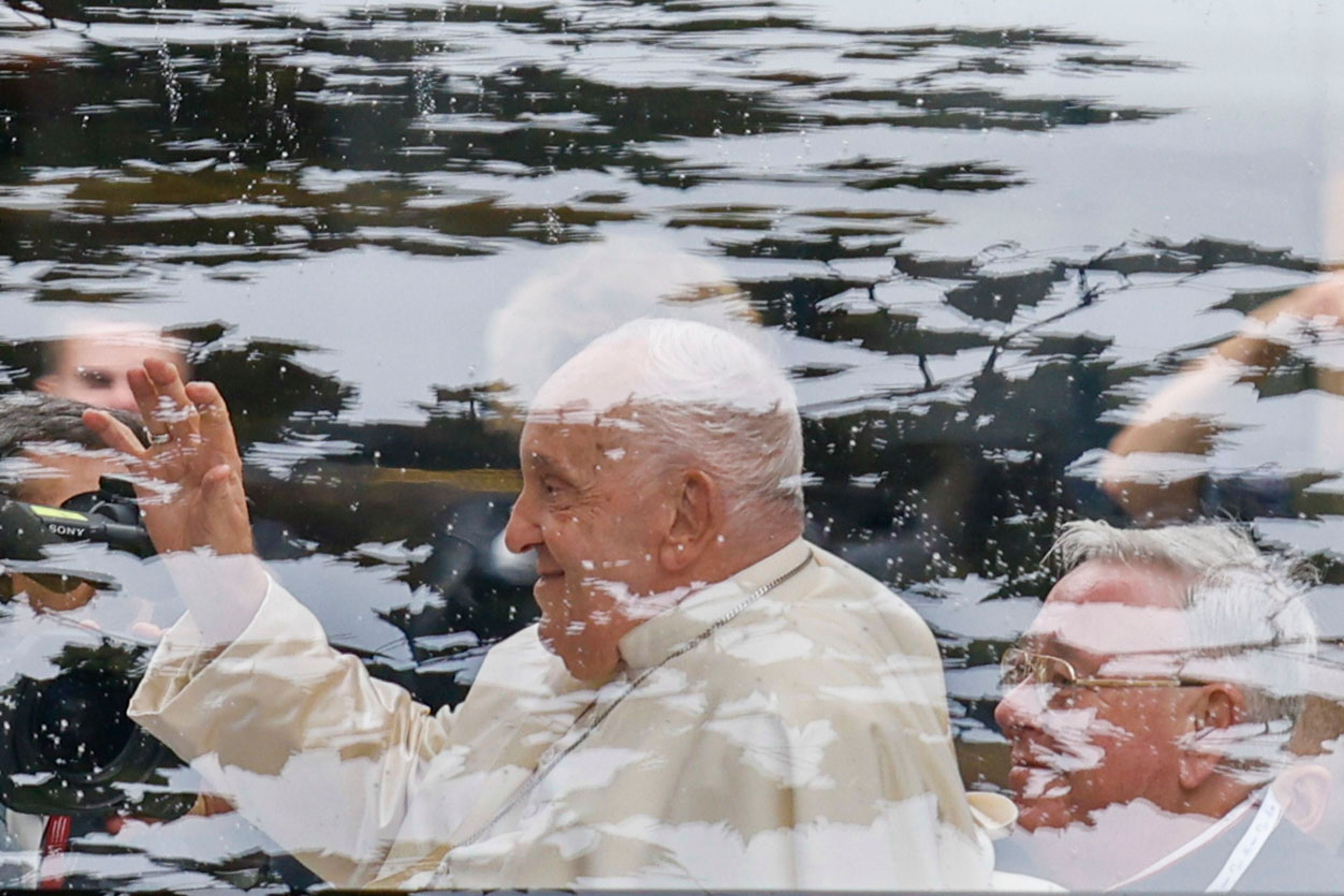 Pope Francis and Archbishop of Luxembourg, Cardinal Jean-Claude Hollerich, right leave in a popemobile the Cercle-Cite convention center in Luxembourg after a meeting with the national authorities and the civil society on the first day of Francis's four-day visit to Luxembourg and Belgium, Thursday, Sept. 26, 2024. (AP Photo/Omar Havana)