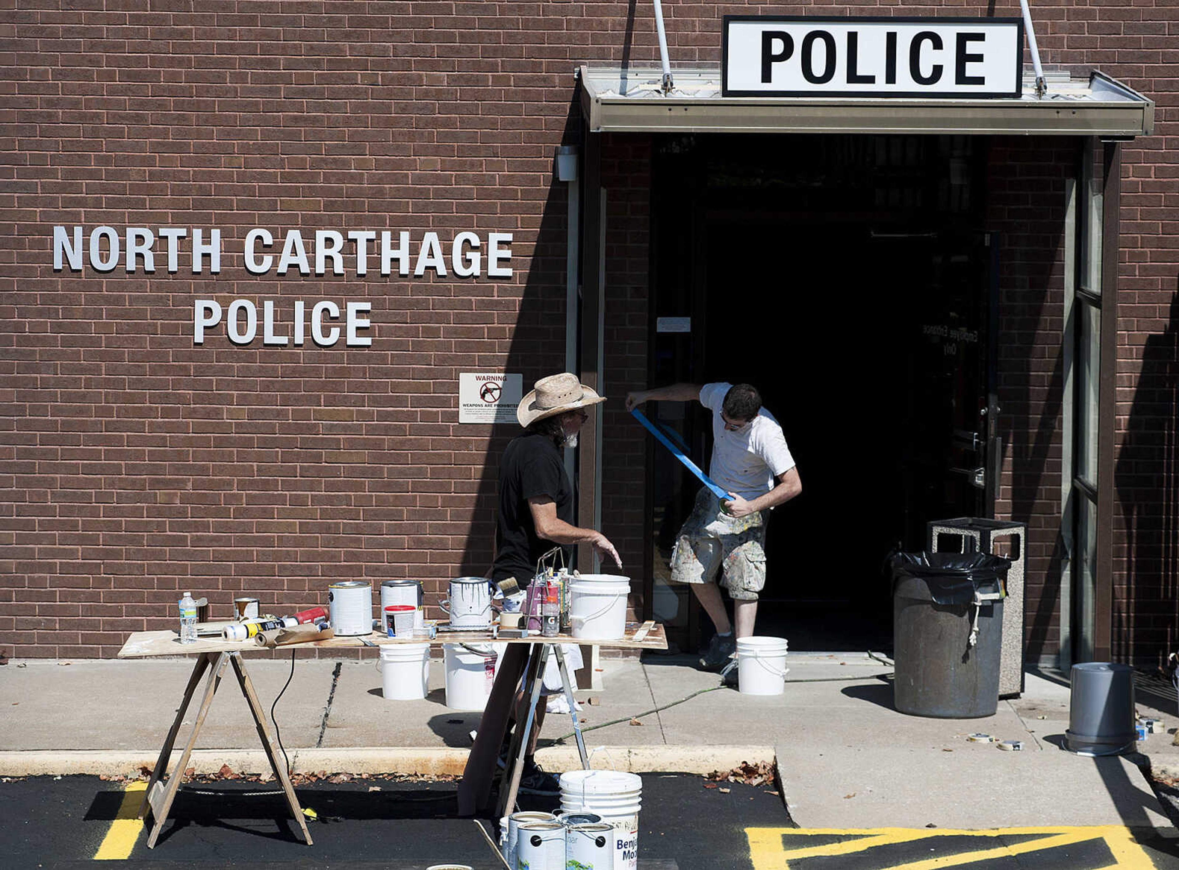 ADAM VOGLER ~ avogler@semissourian.com
Crew members for the 20th Century Fox's feature film "Gone Girl" work to transform the old Federal Building on Broadway into the headquarters of the fictional North Carthage Police Department Friday, Sept. 27, in Cape Girardeau.