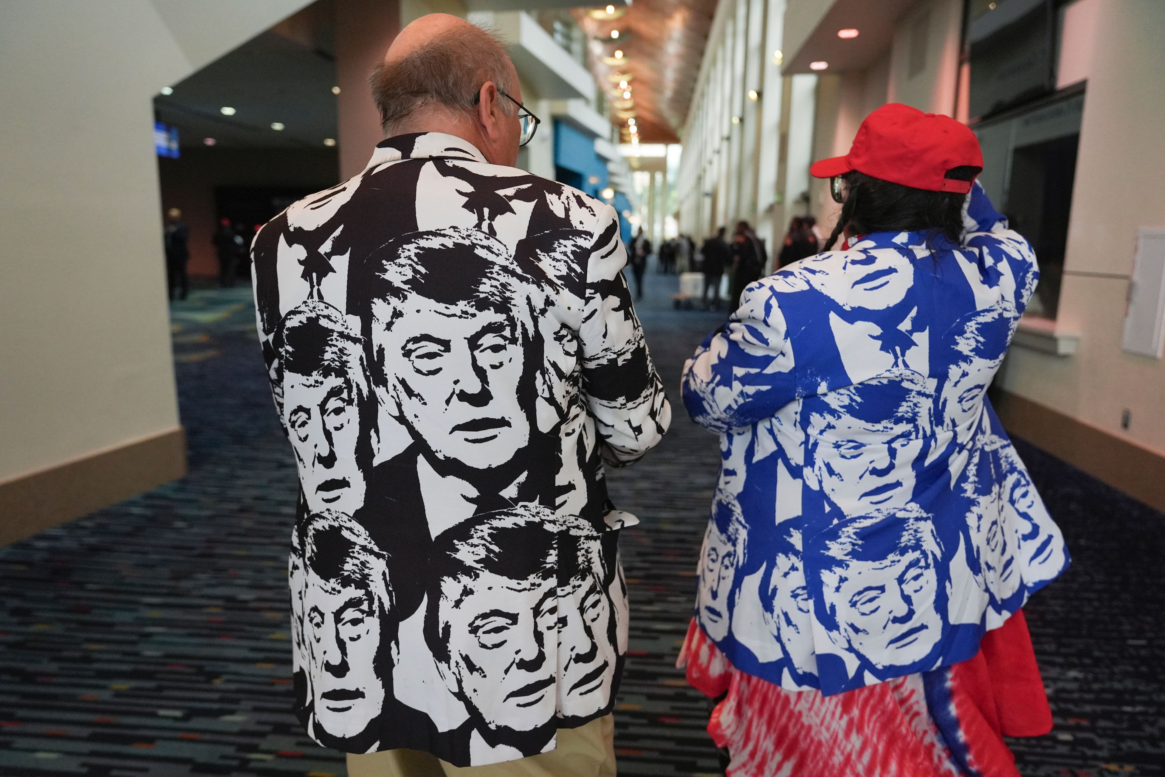 Steve and Jodie McGuire of Bettendorf, Iowa, arrive to attend a watch party for Republican Presidential nominee former President Donald Trump at the Palm Beach County Convention Center during an election night watch party, Tuesday night, Nov. 5, 2024, in West Palm Beach, Fla. (AP Photo/Lynne Sladky)