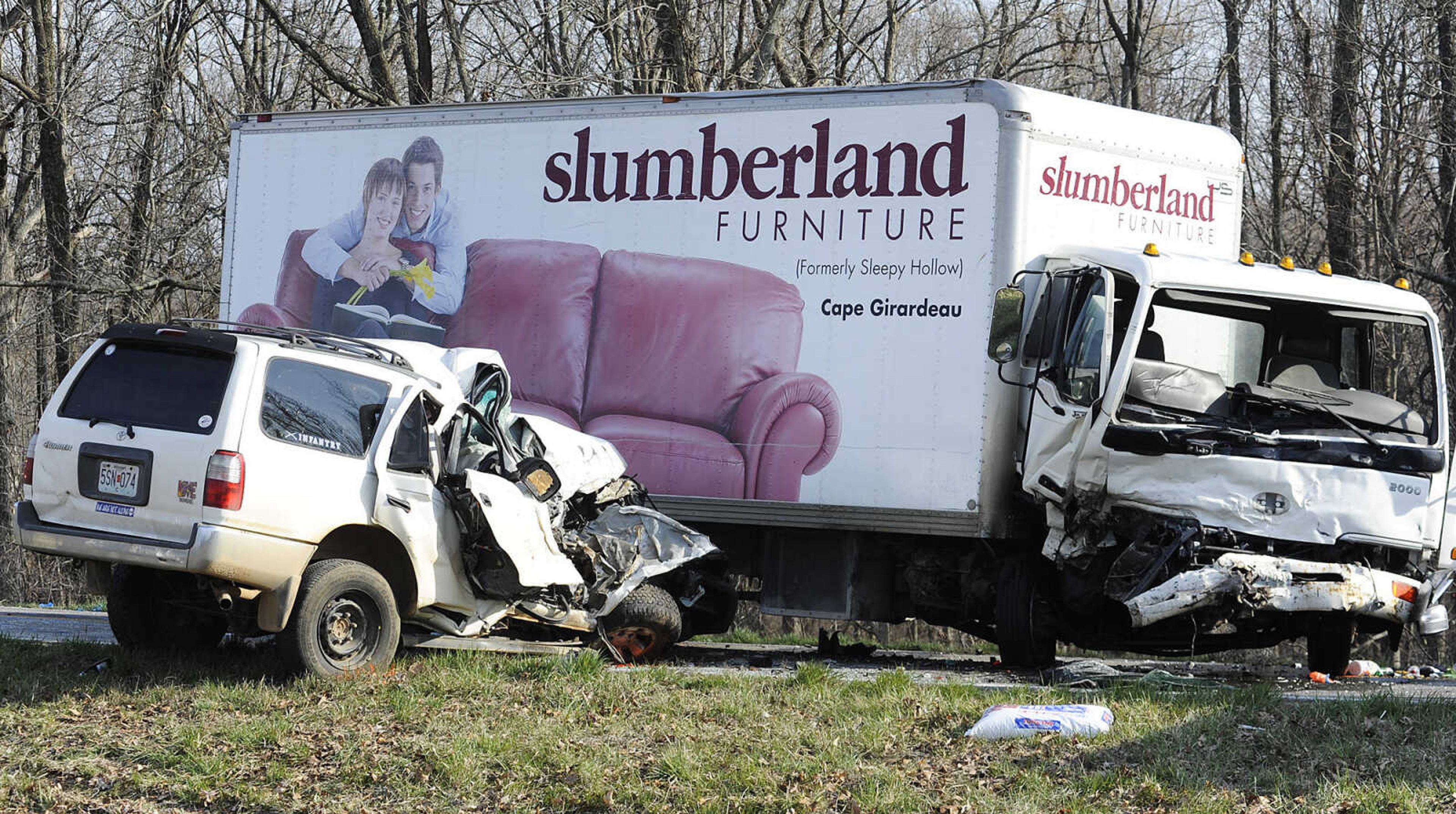 A Slumberland box truck and an SUV sit damaged after a collision on Highway 34 near Route U in Cape Girardeau County on Friday. (Adam Vogler)