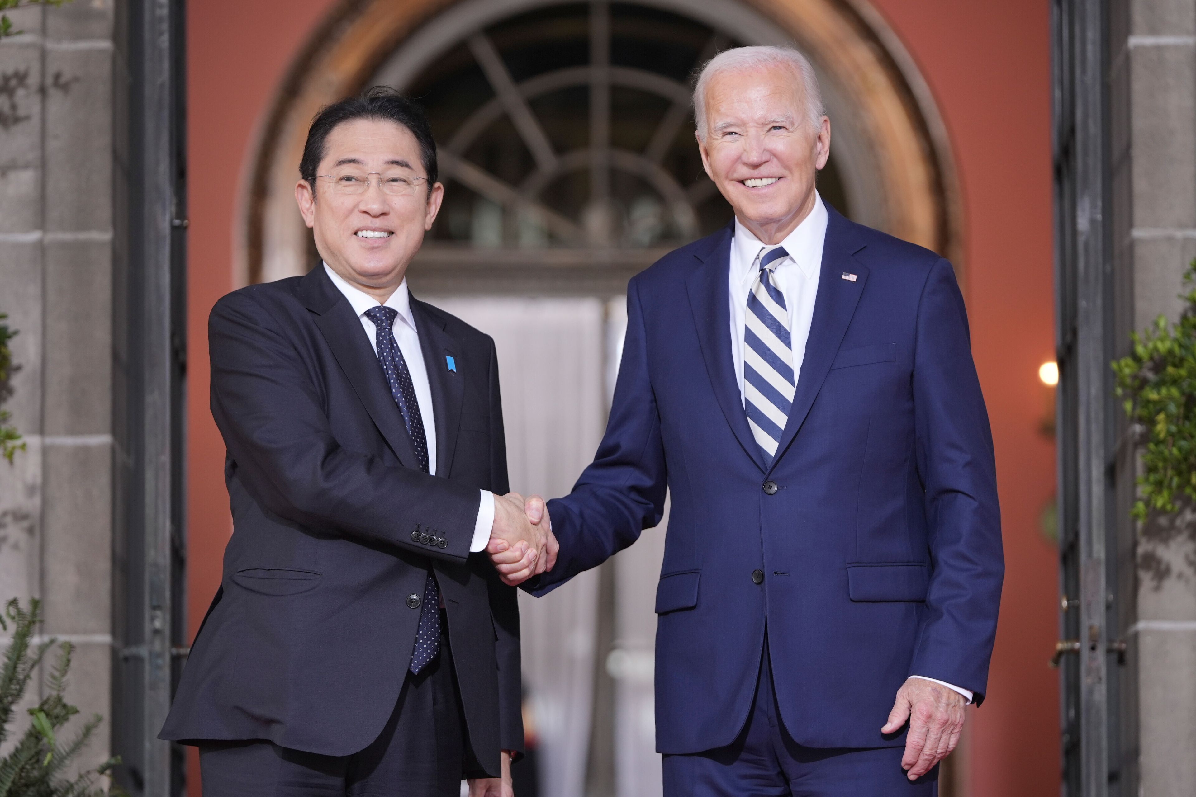 President Joe Biden greets Japan's Prime Minister Fumio Kishida at the Quad leaders summit at Archmere Academy in Claymont, Del., Saturday, Sept. 21, 2024. (AP Photo/Mark Schiefelbein)