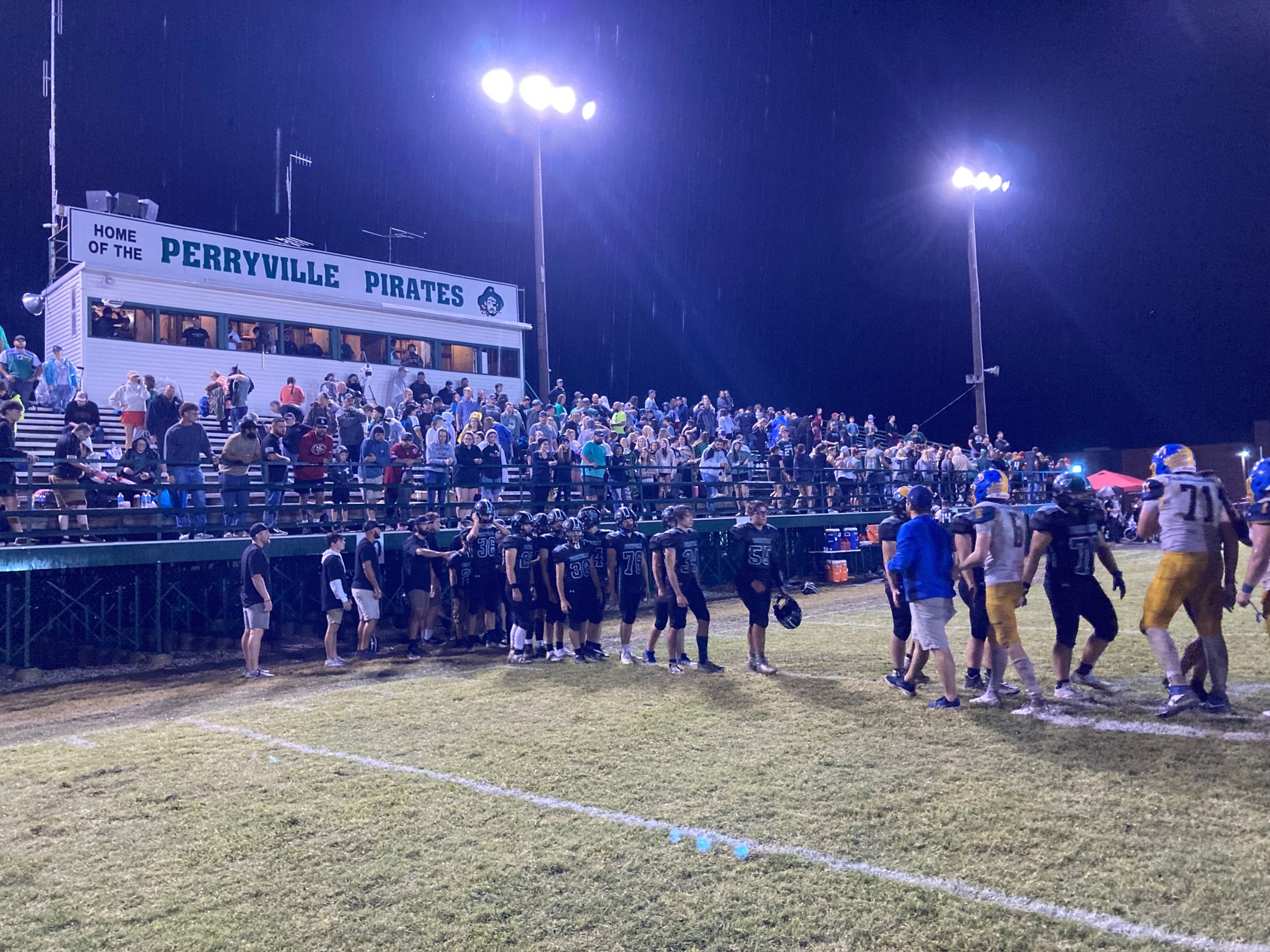 St. Vincent players congratulate Perryville after the Indians' 29-25 road win over the Pirates Sept. 13.