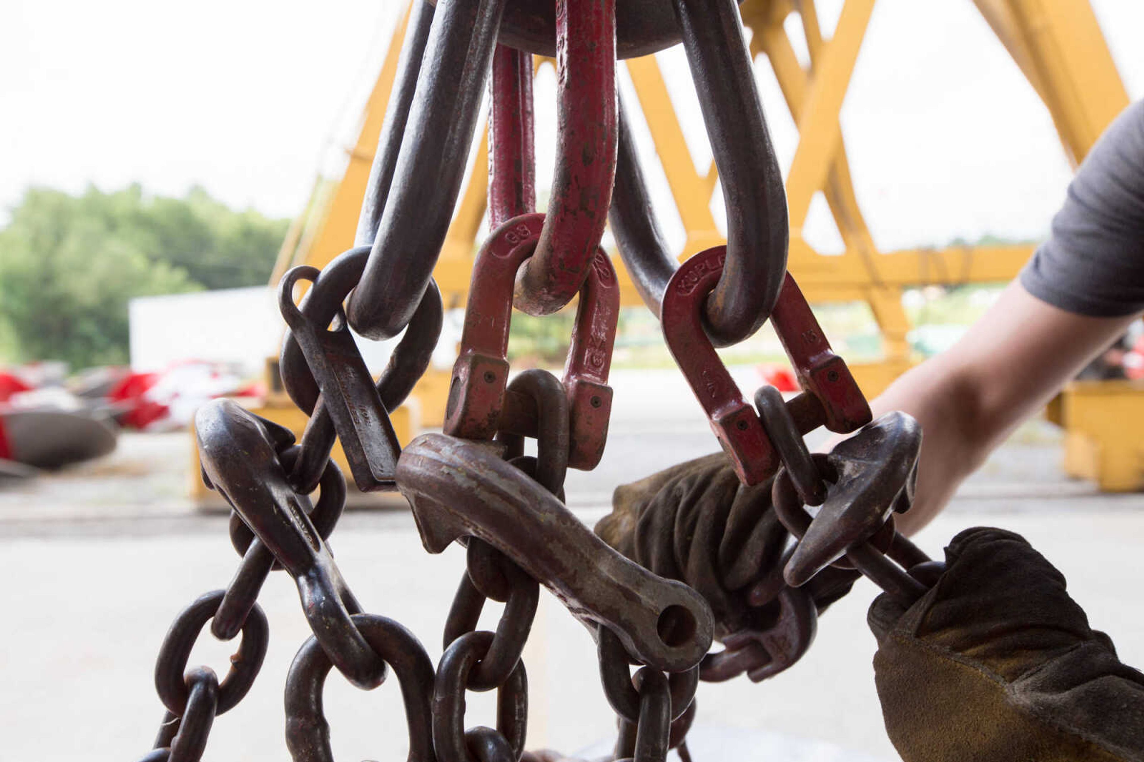 GLENN LANDBERG ~ glandberg@semissourian.com

Kyler Hale hooks up chains to a propeller being moved outside the repair shop at Missouri Dry Dock and Repair Co. in Cape Girardeau Wednesday, July 28, 2016.