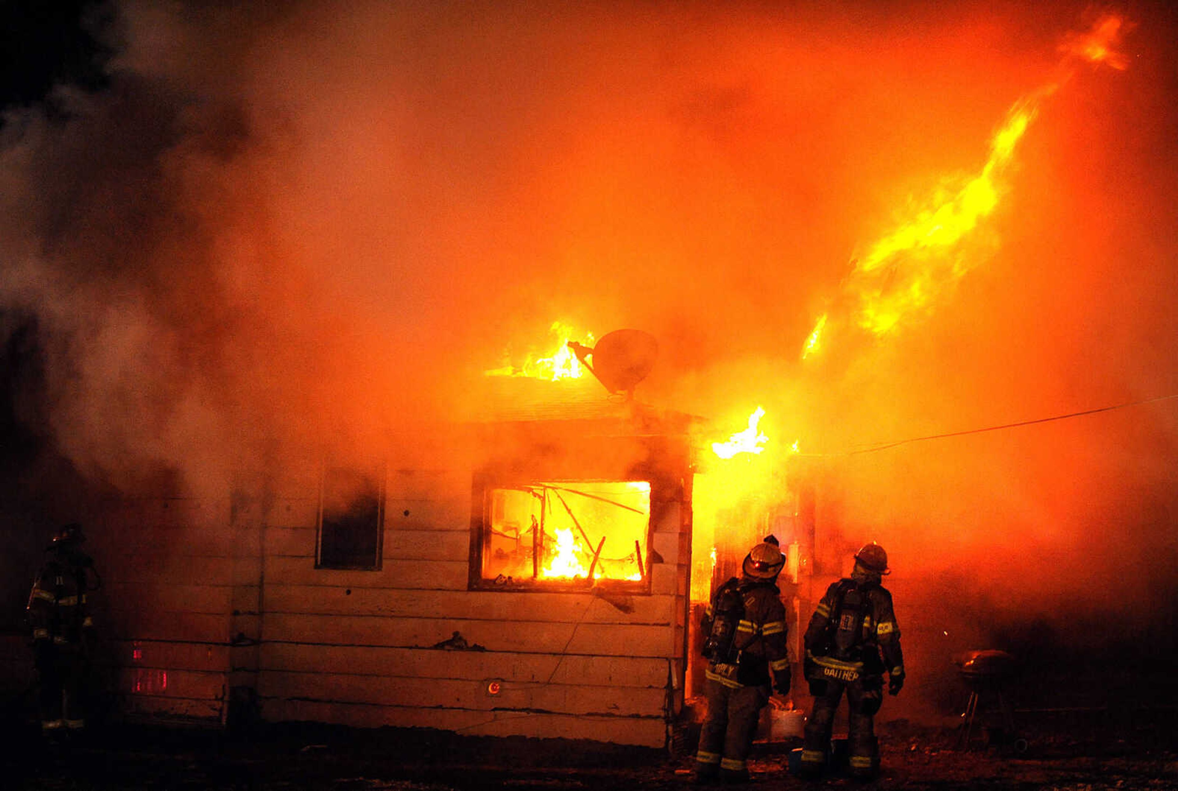 LAURA SIMON ~ lsimon@semissourian.com

Members of the Scott City and Cape Girardeau fire departments battle a blaze at 308 W. Missouri Blvd. in Scott City, Wednesday, Dec. 18, 2013. Nobody was injured in the fire.