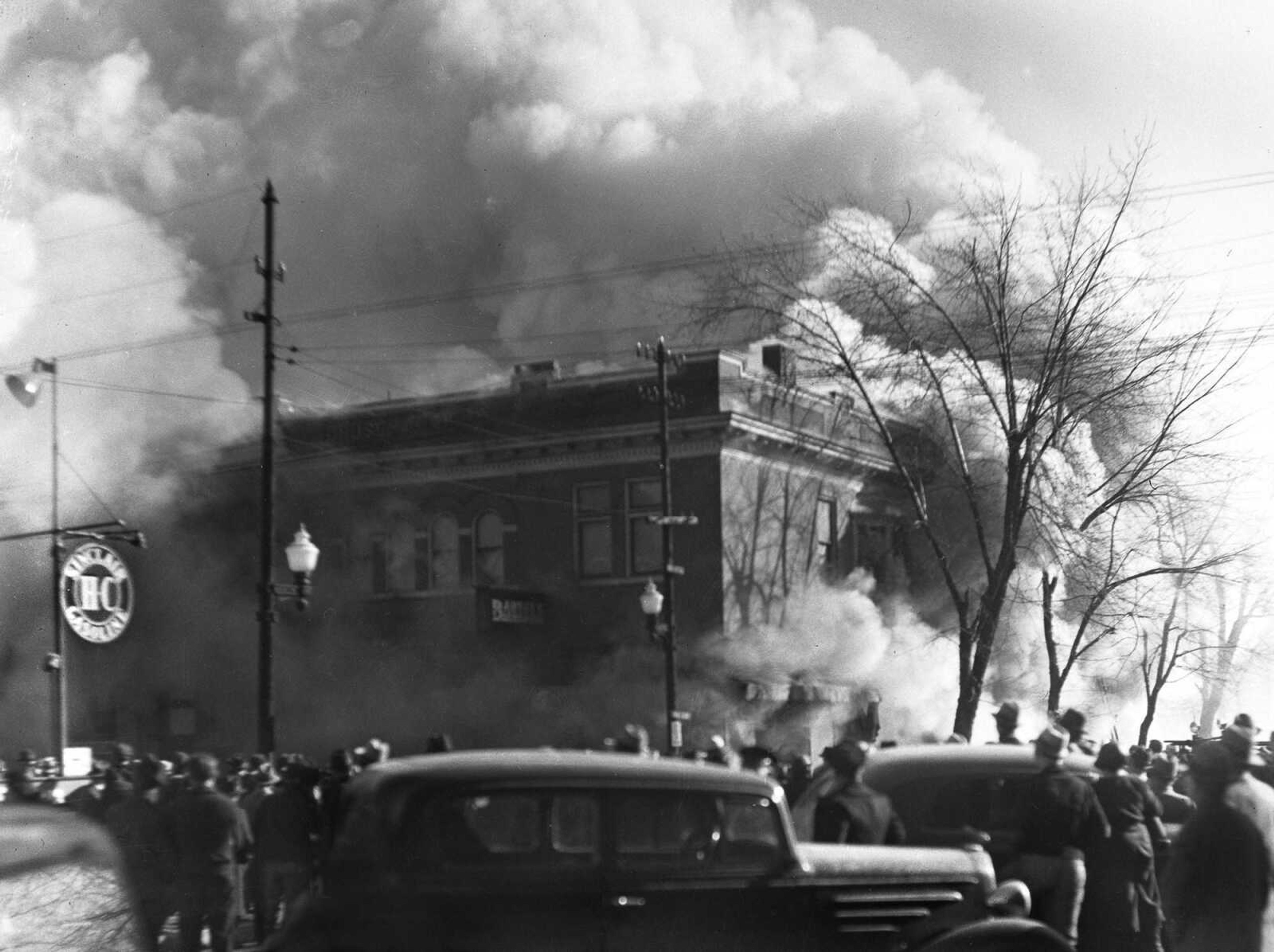 Feb. 4, 1937, a large crowd watches fire consume Bartels Mercantile Co. Store, Broadway and Ellis. Fire broke out in the basement shortly after 1 p.m. and by 3 p.m. was out of control. The store was gutted, and three apartments and the medical offices of Dr. R.A. Ritter on the second floor were destroyed. (G.D. Fronabarger photo)