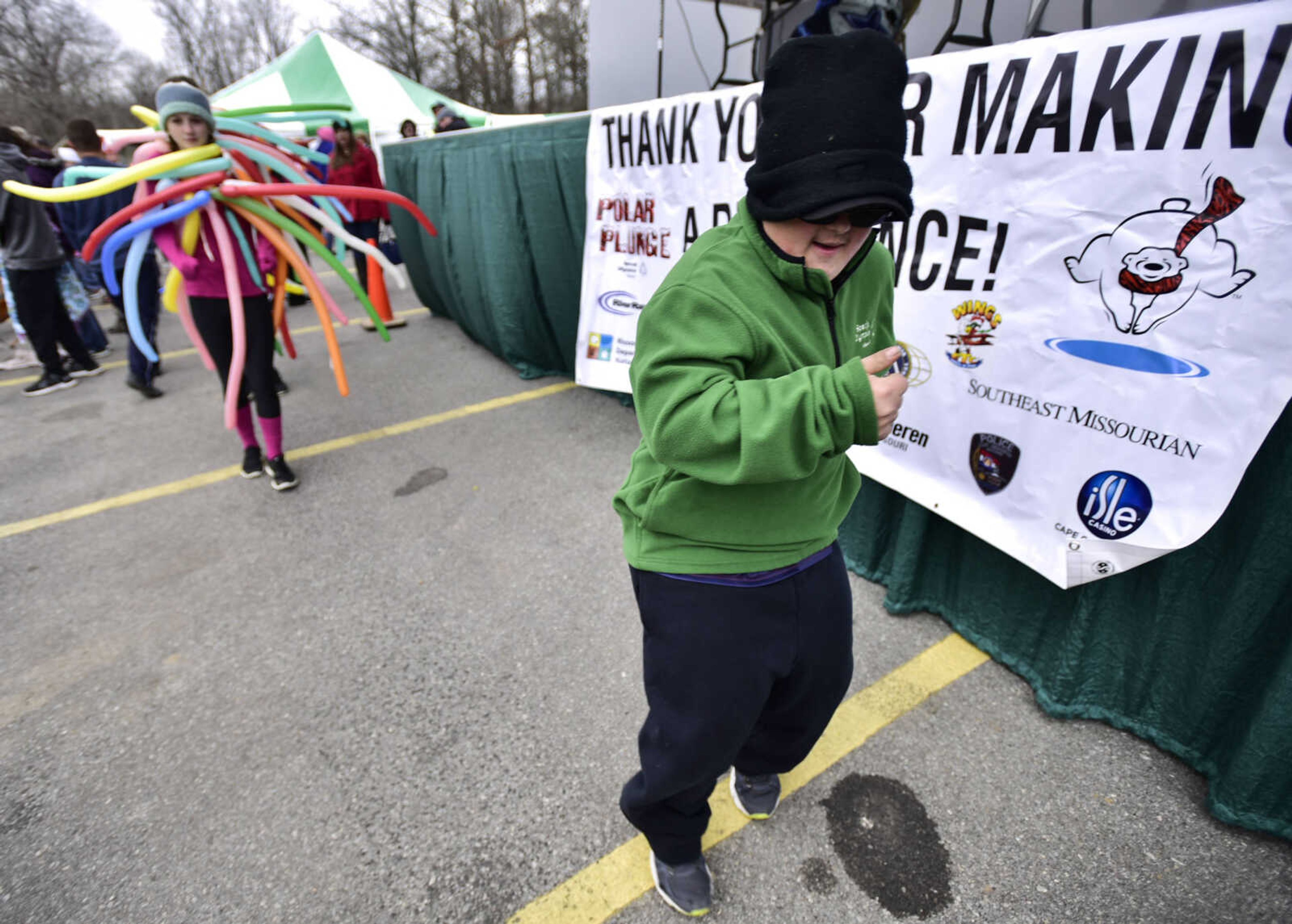 Logan Garner dances before the start of a Polar Plunge benefit for Special Olympics Missouri on Saturday, Feb. 3, 2018, at Trail of Tears State Park.