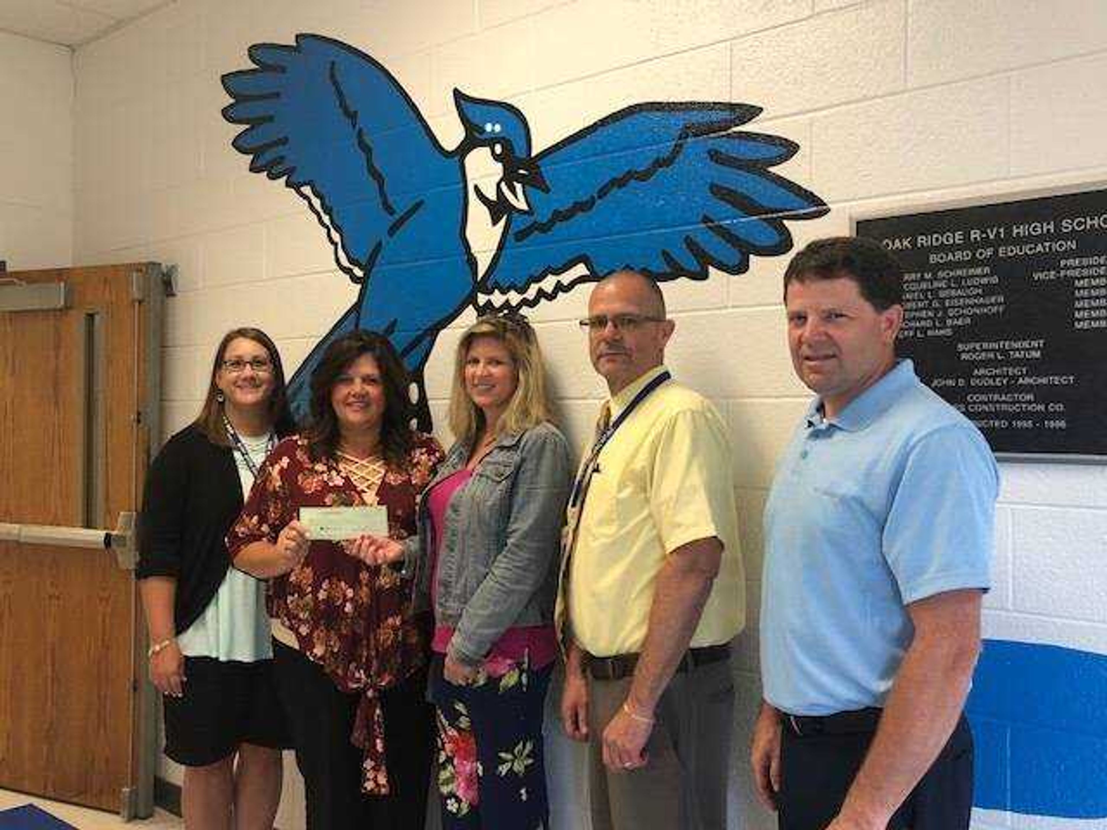 Pictured are; April Brumfield, The Oak Ridge School Curriculum Director, Cheryl Farrow, Director of Operations for  Shannon Davis'  Organization, Amy Blackman, FACS Teacher, Allan Horrell, Oak Ridge High School Principal, and Dr. Adrain Eftink, Oak Ridge Superintendent.