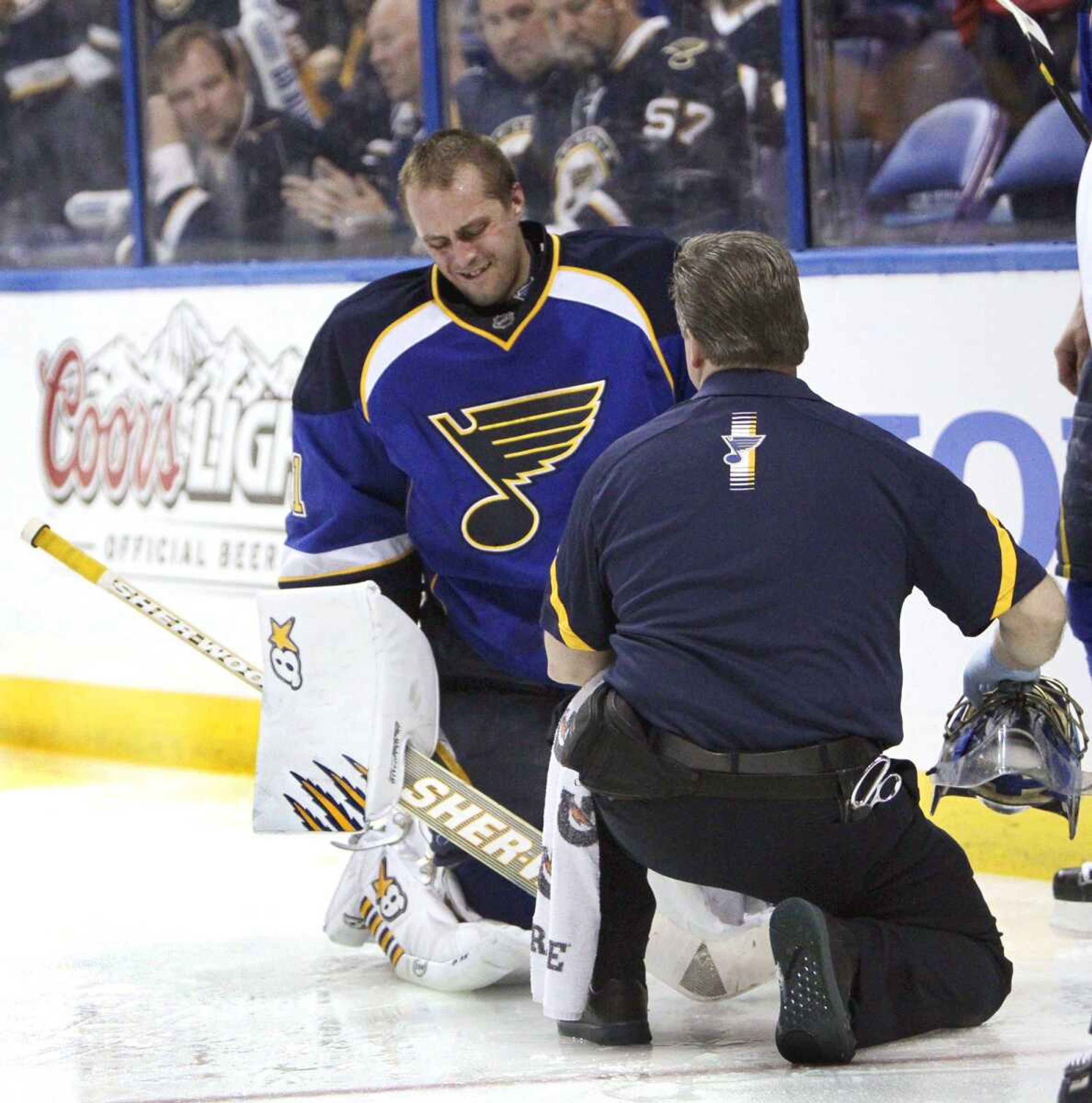 Blues goaltender Jaroslav Halak is tended to by trainer Ray Barile after he collided with teammate Barret Jackman during Game 2 of St. Louis&#8217; first-round playoff series against the San Jose Sharks. (Chris Lee ~ St. Louis Post-Dispatch)