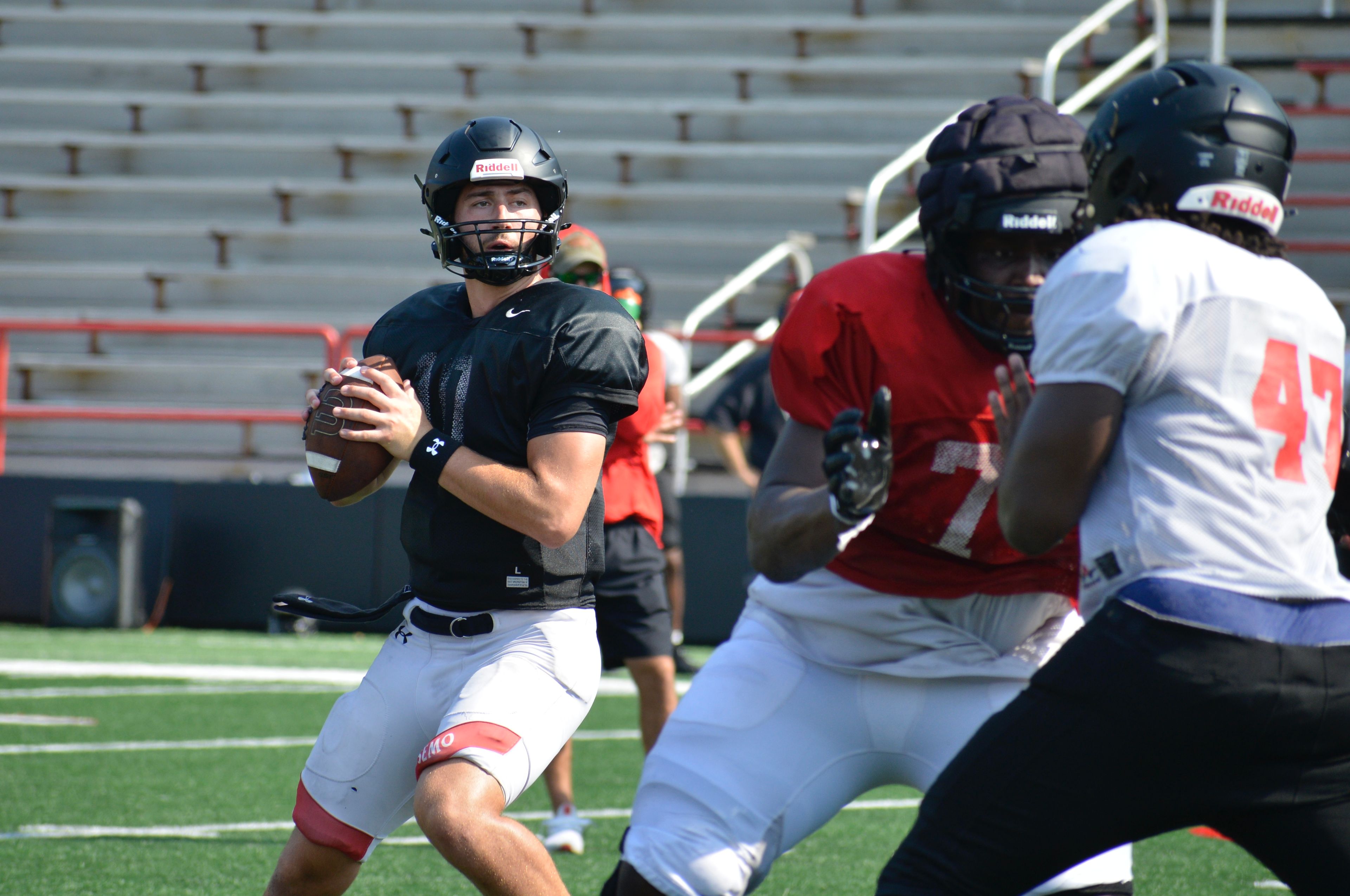 Southeast Missouri State quarterback Paxton DeLaurent looks for a target to pass during a recent scrimmage at Houck Field. 