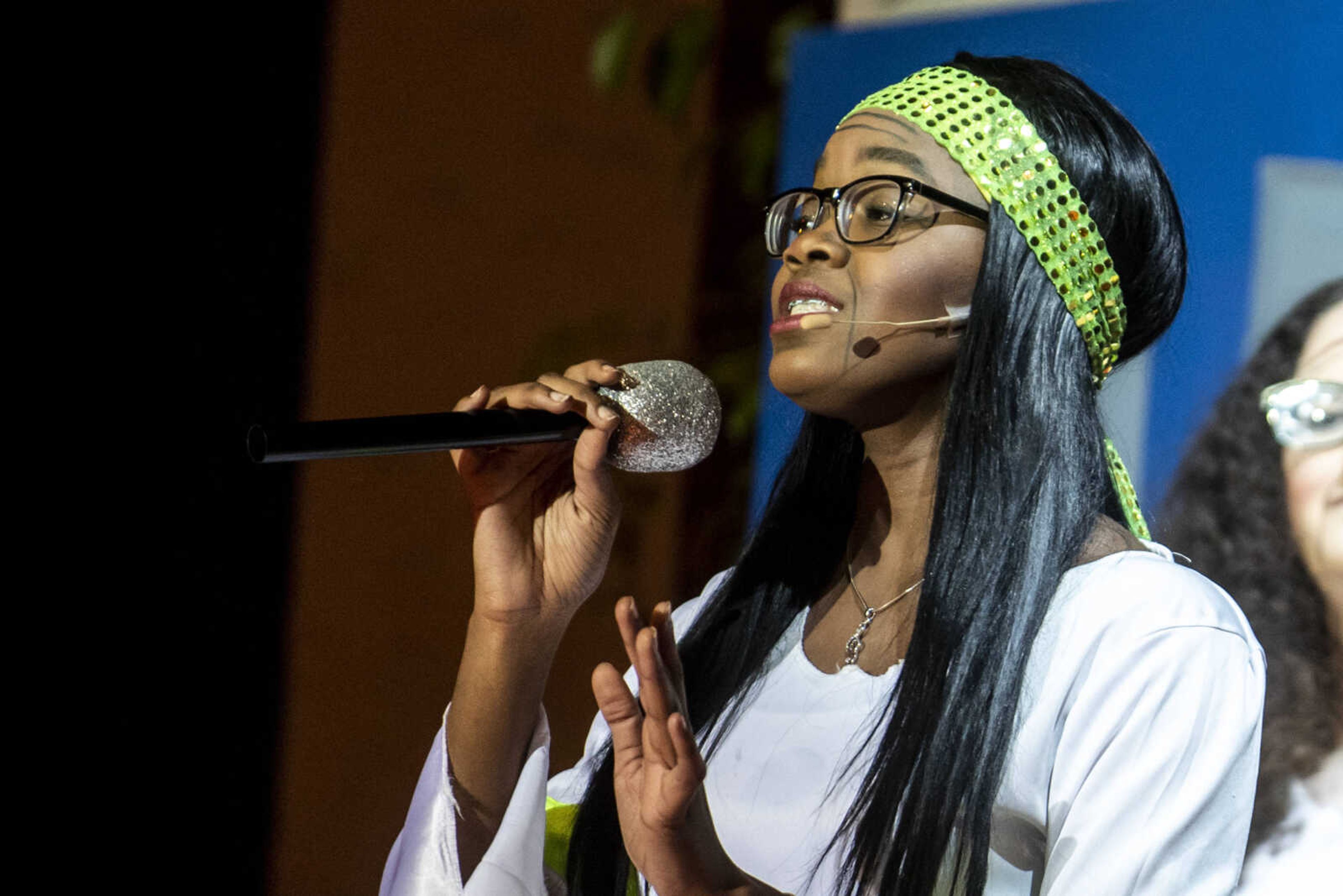 Peighton Robinson, 17, sings "Super Trooper" while portraying the character Donna Sheridan during the first act of at Cape Central High School's spring musical production of "Mamma Mia!" Wednesday, April 10, 2019, in Cape Girardeau.