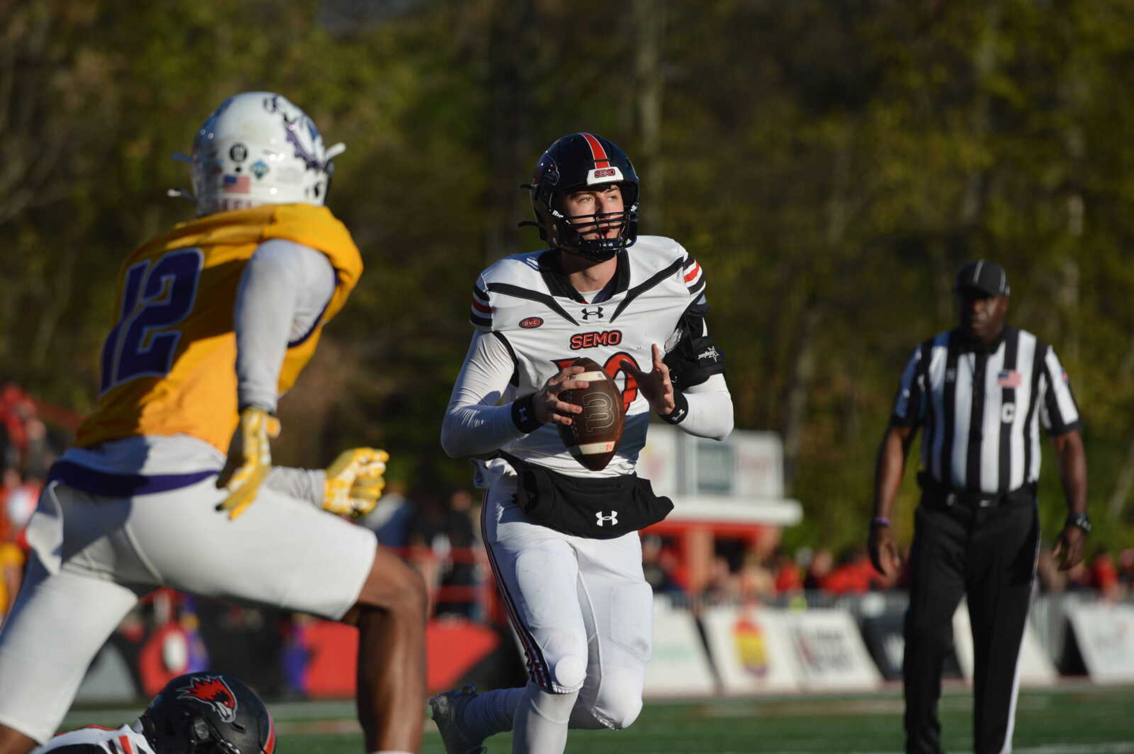 SEMO quarterback Paxton DeLaurent scrambles out of the pocket and looks downfield for an open receiver against Western Illinois on Saturday, Nov. 16, at Houck Field.