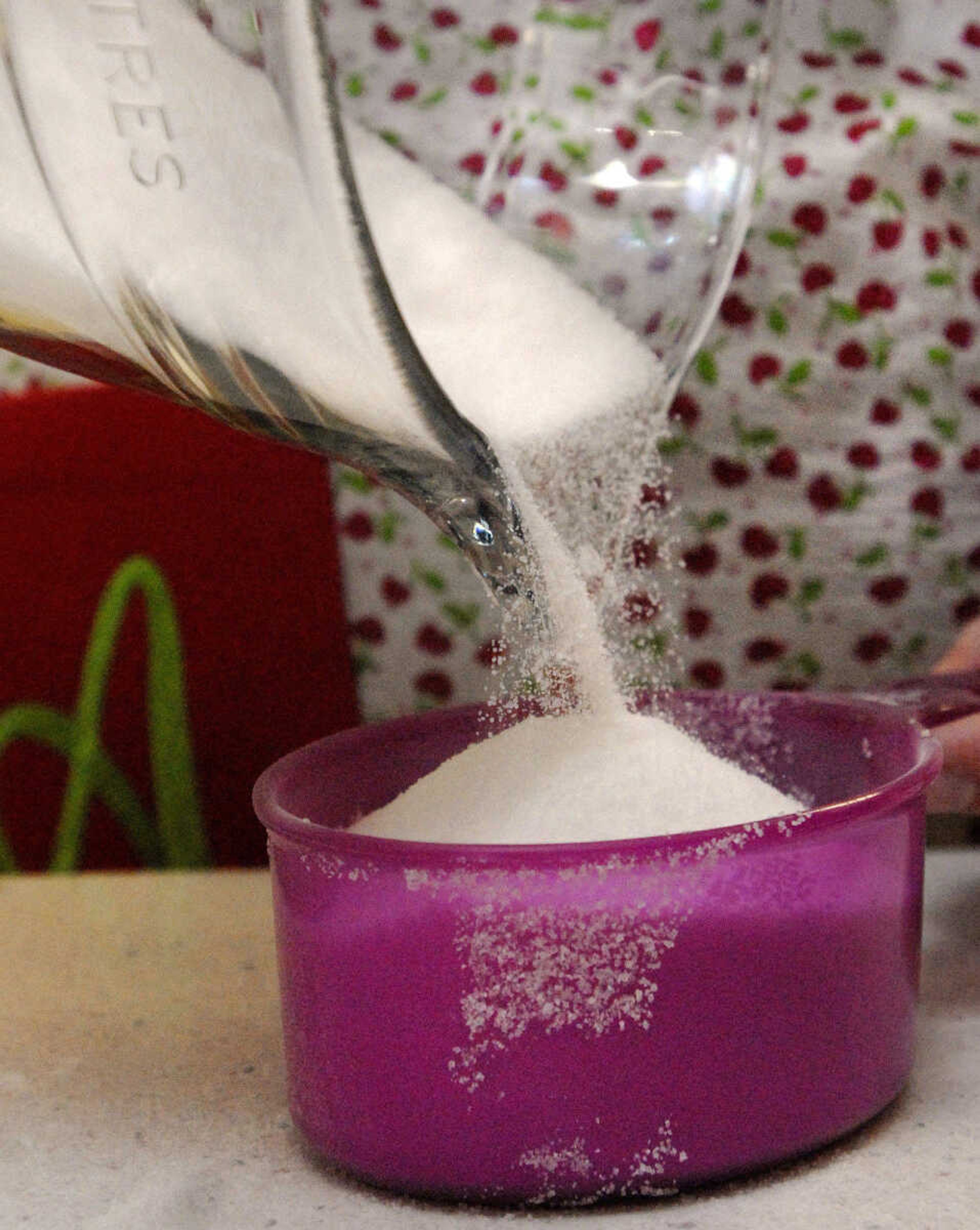 LAURA SIMON~lsimon@semissourian.com
Sugar is carefully measured for the poured fondant Saturday, February 5, 2011.