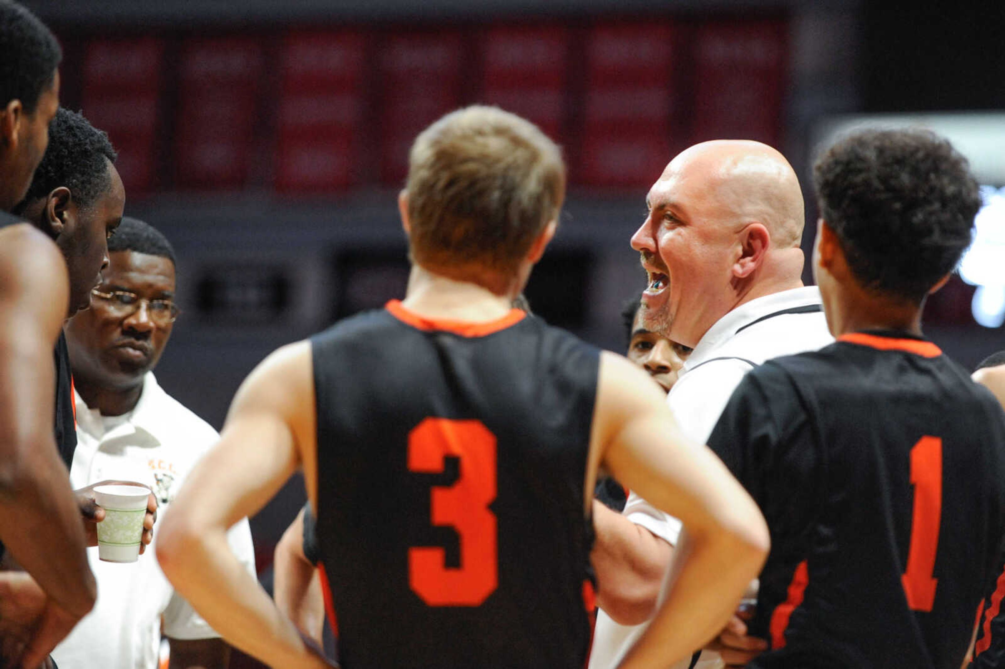 Scott County Central coach Matt Cline talks with players at the start of the second quarter during the fifth place game of the Southeast Missourian Christmas Tournament Wednesday, Dec. 30, 2015 at the Show Me Center. (Glenn Landberg)