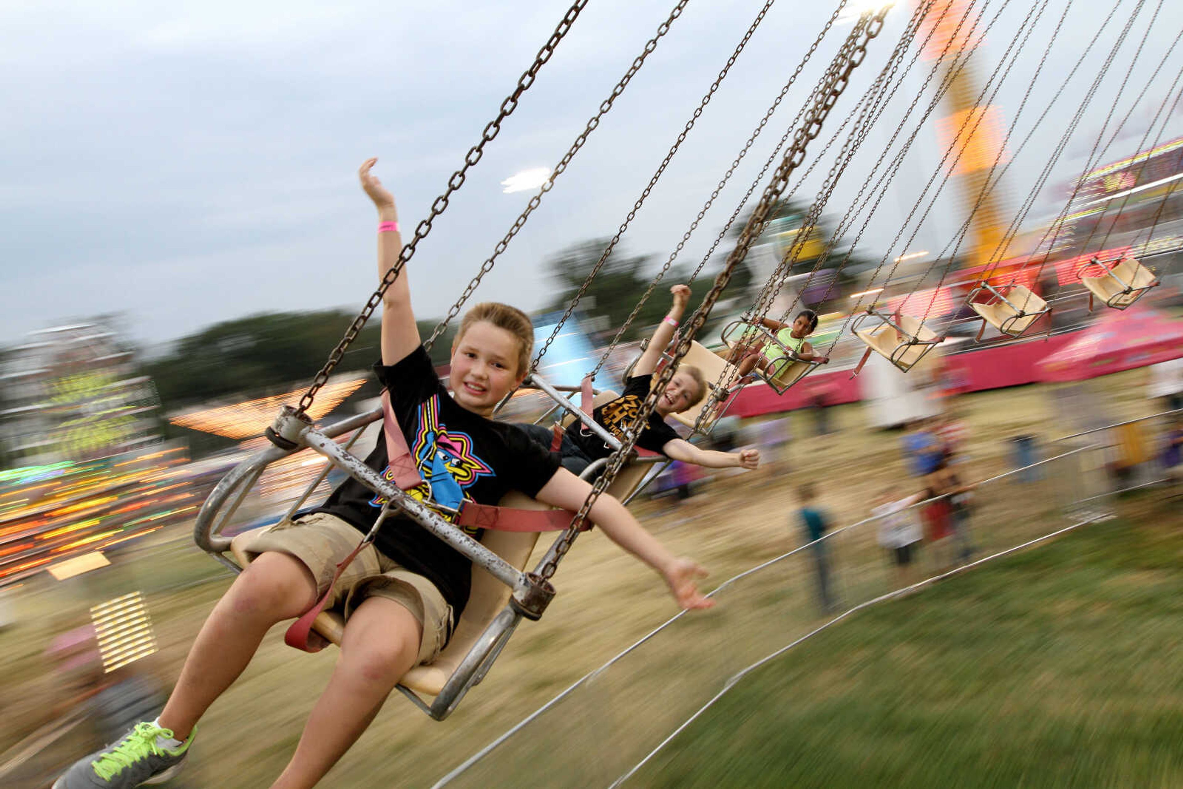 GLENN LANDBERG ~ glandberg@semissourian.com

Mason Eubanks, left, and friend Adam Birk ride the Yo-Yo ride during the SEMO District Fair Wednesday, Sept 10, 2014 at Arena Park in Cape Girardeau.