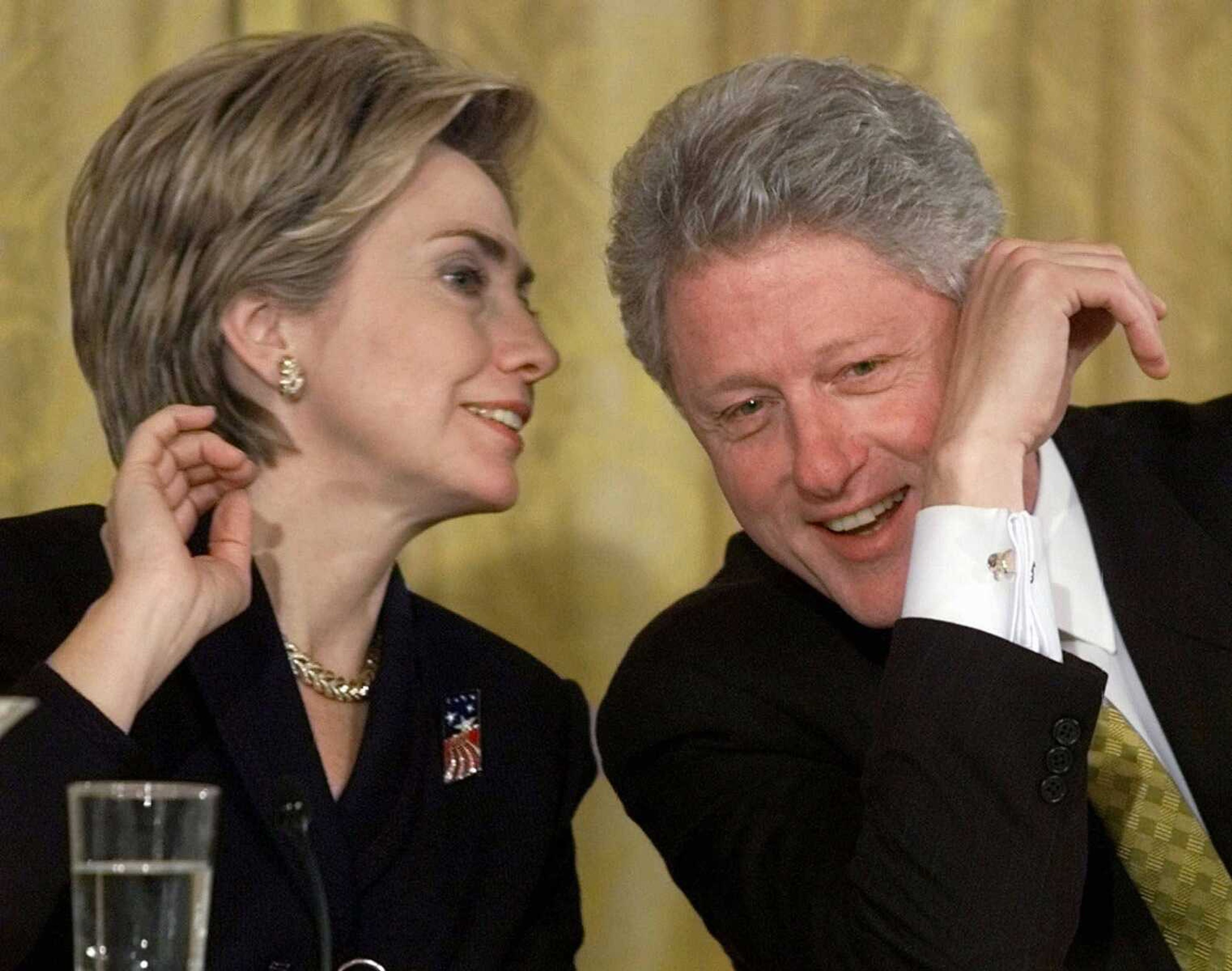 President Bill Clinton and first lady Hillary Rodham Clinton talk during the White House Conference on Philanthropy in 1999 at the White House. (Khue Bui ~ Associated Press)