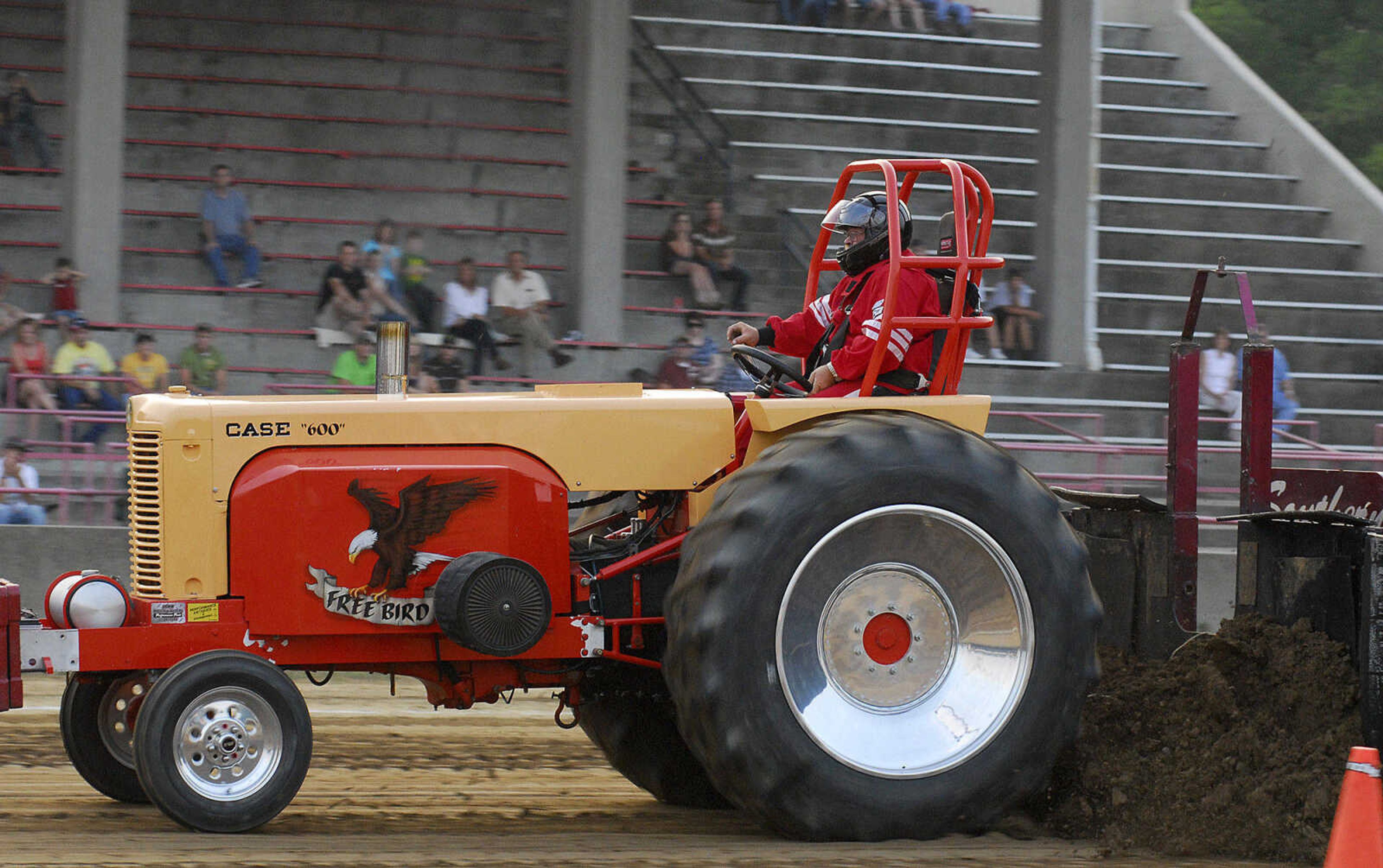 LAURA SIMON~lsimon@semissourian.com
"Free Bird" keeps on pulling as the 20,000 pound weight creates more drag as it slides closer to the tractor Saturday, May 29, 2010 during the "Pullin' for St. Jude" tractor and truck pull at Arena Park.