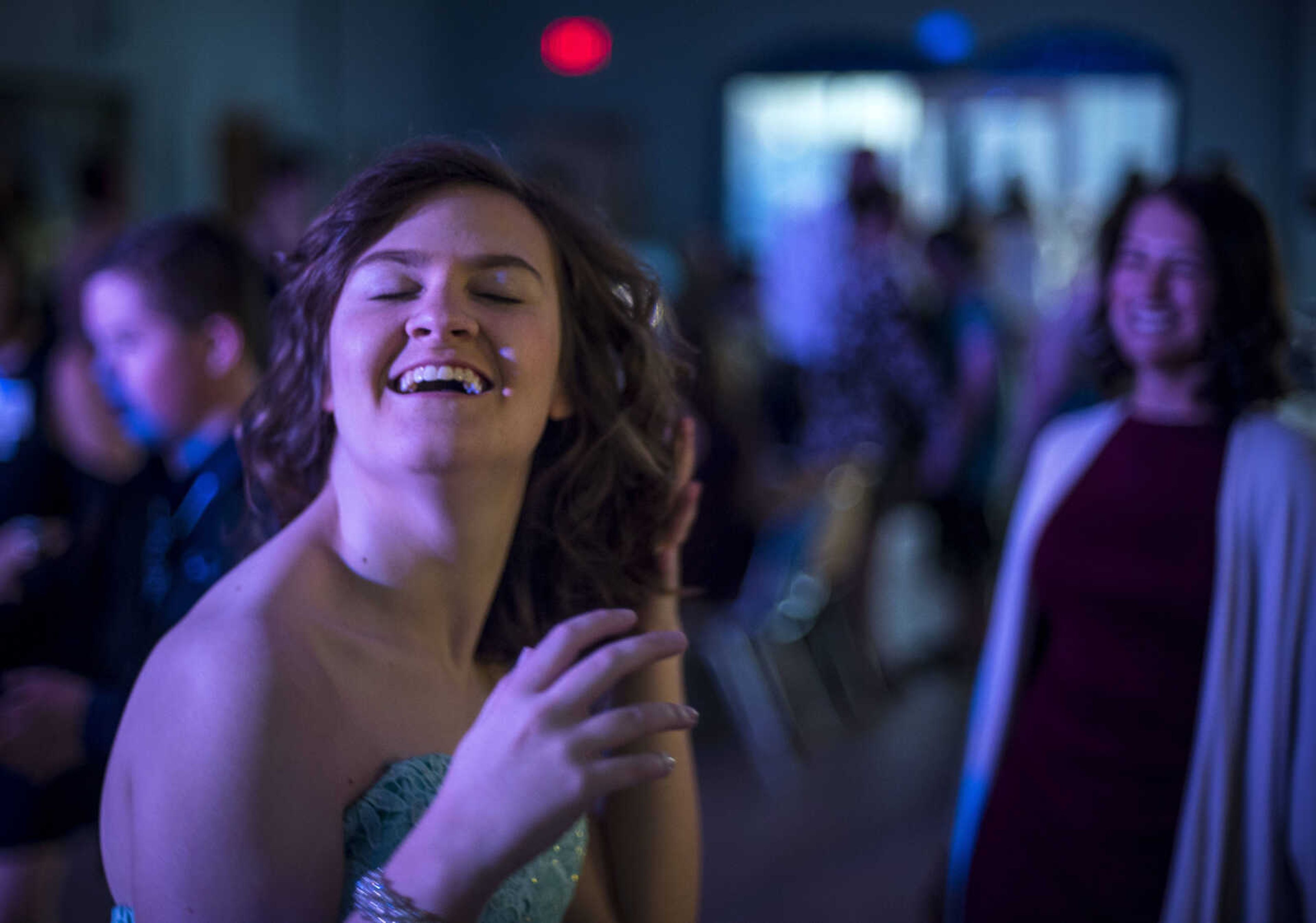 Amanda Scholl smiles while dancing during the Blue Light Ball Friday, April 12, 2019, at SEMO Alliance for Disability Independence, Inc. in Cape Girardeau.