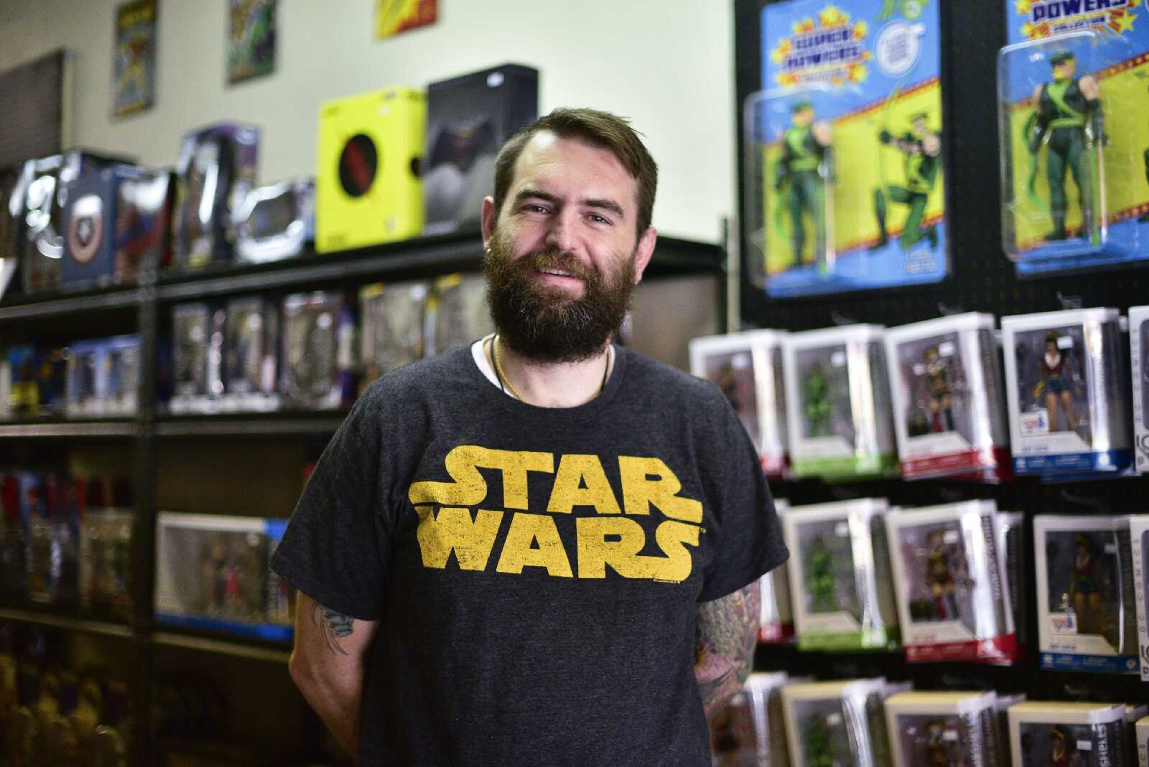 Matthew Rodden, owner of The Toy Bomb, poses for a photo in his shop Wednesday at 521 Broadway in Cape Girardeau. The Toy Bomb offers a variety of vintage to modern-day-era toys, action figures and collectibles in downtown Cape Girardeau.