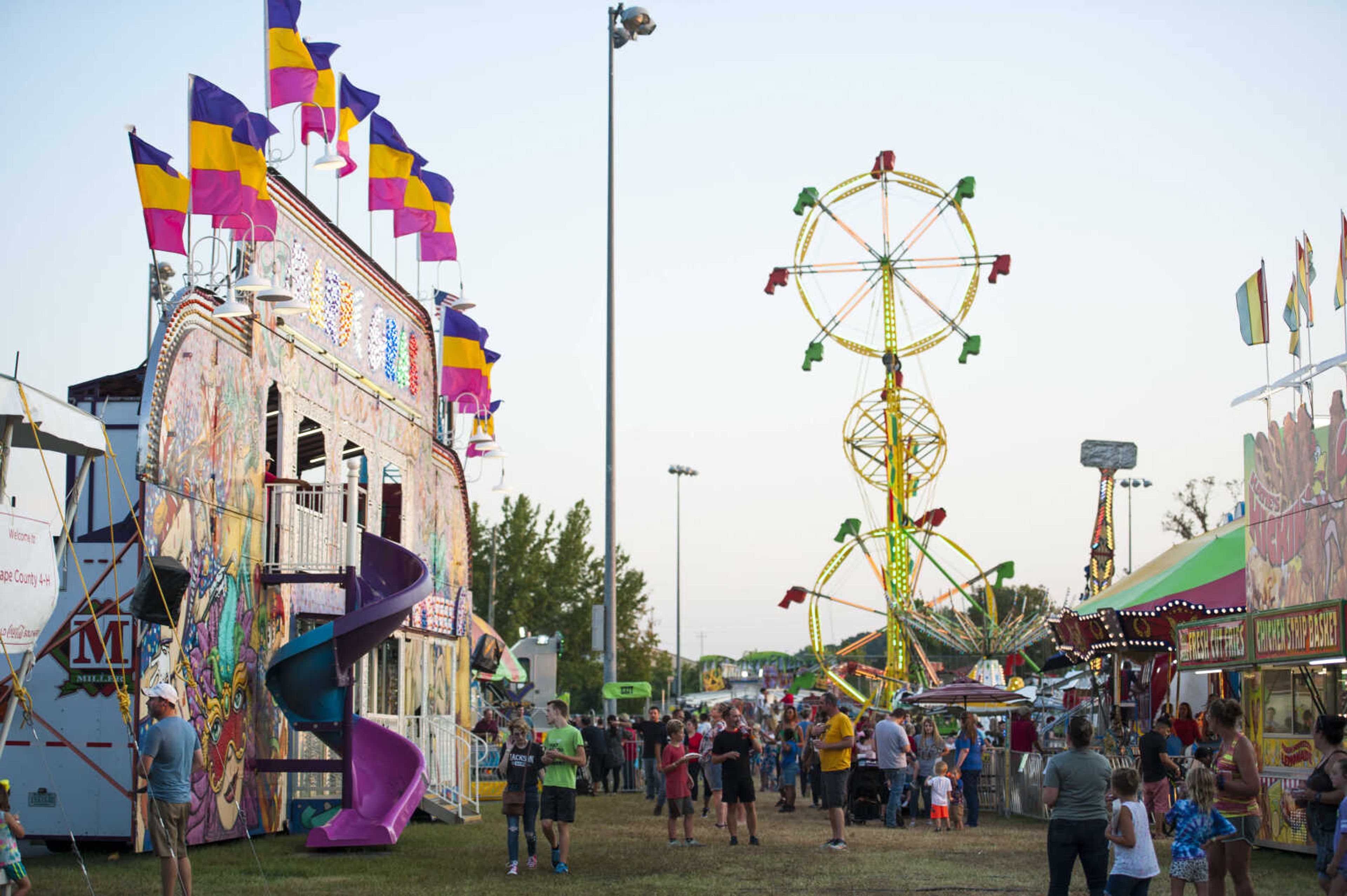 Fairgoers walk through the midway Sept. 9, 2019, at the SEMO District Fair in Cape Girardeau.