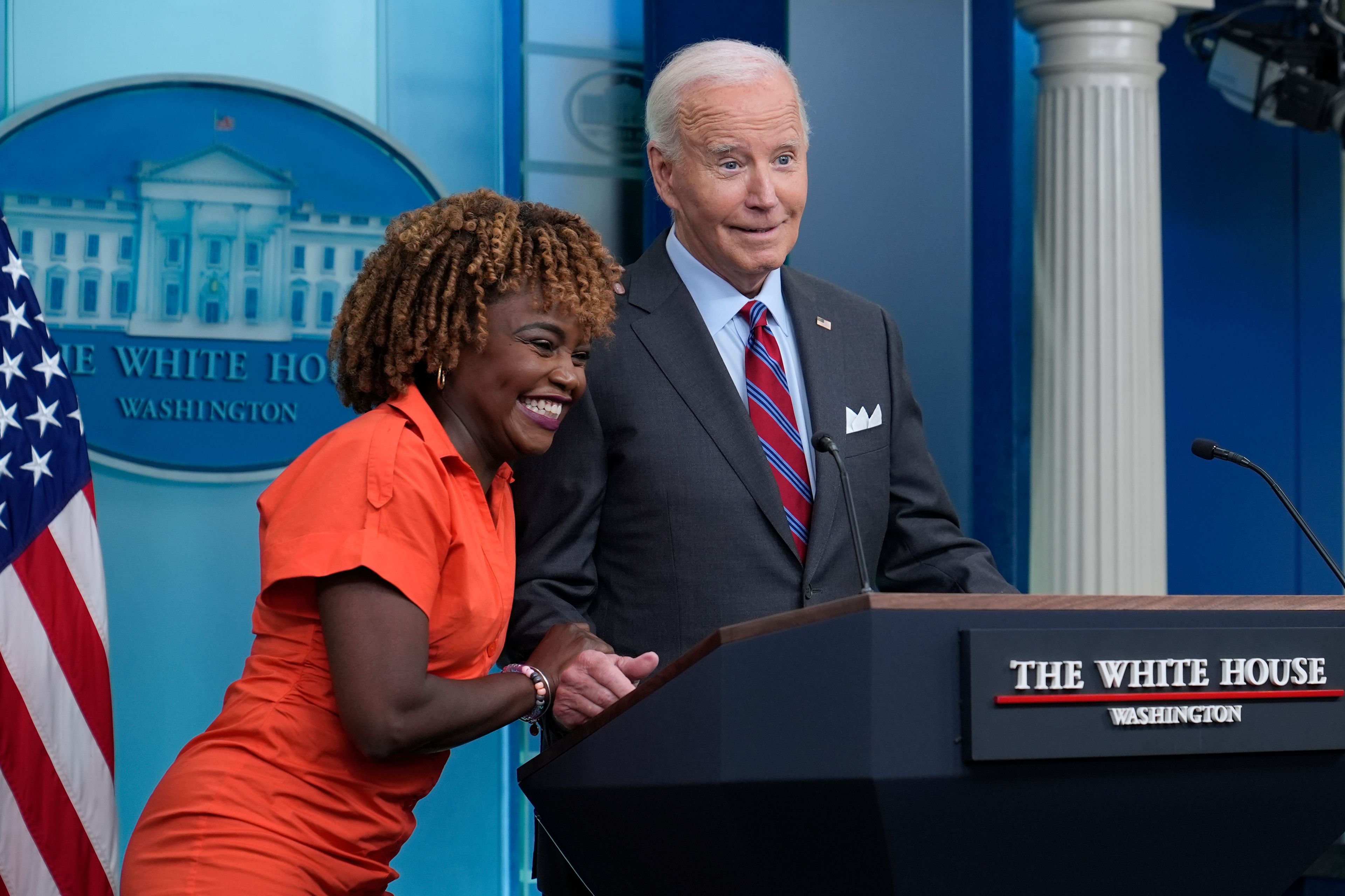 President Joe Biden shares a laugh with White House press secretary Karine Jean-Pierre when Biden made a surprise appearance during the daily briefing at the White House in Washington, Friday, Oct. 4, 2024. (AP Photo/Susan Walsh)