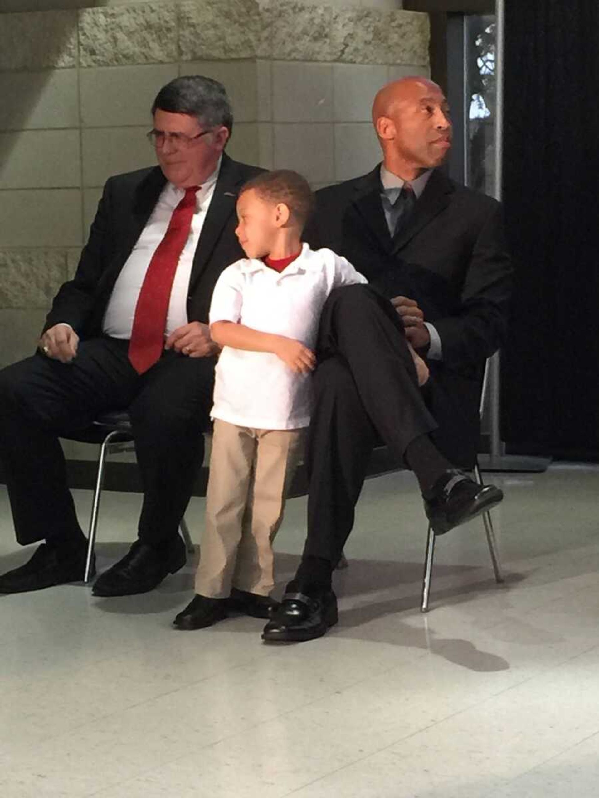 Rick Ray, right, is joined by his son, Deacon, middle, and university President Dr. Kenneth Dobbins after Ray was announced as the Southeast Missouri State men's basketball coach at a press conference Monday evening at the Show Me Center. (Erin Unerstall)