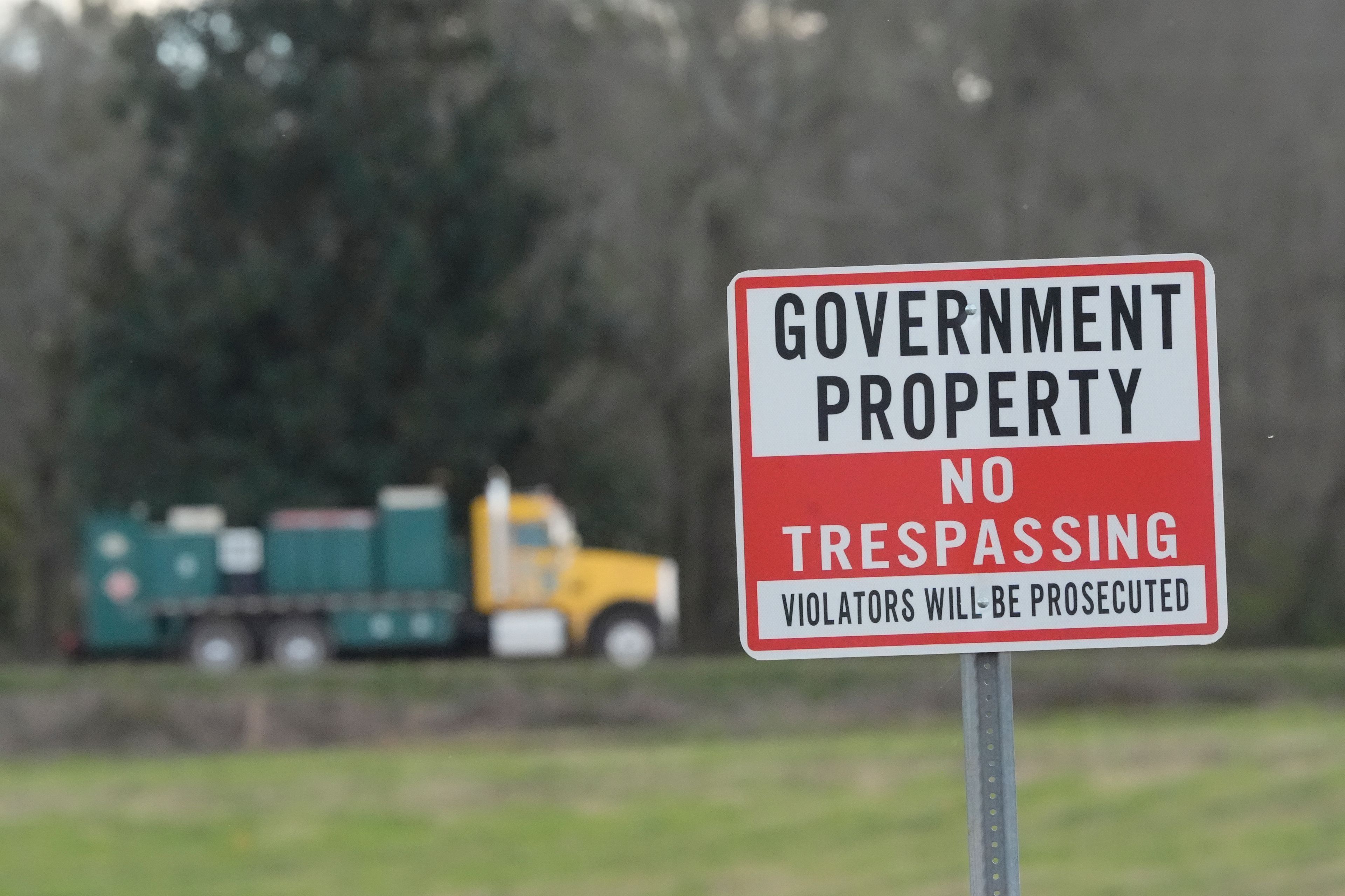 FILE - A truck leaves the site of a planned Rivian electric truck plant March 7, 2024, in Rutledge, Ga. (AP Photo/John Bazemore, File)